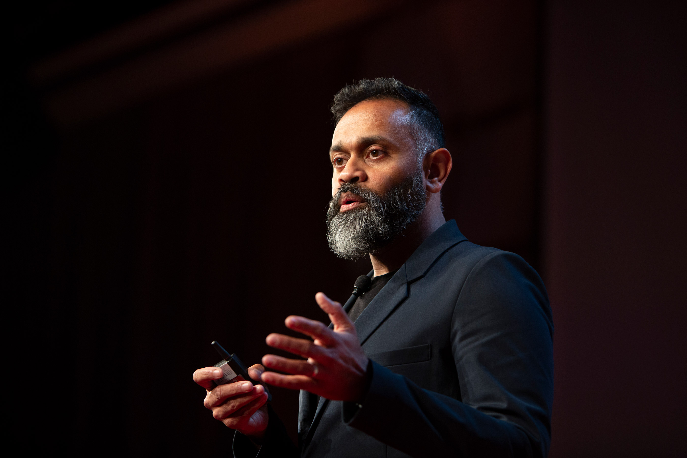 Photo of Ganesh Bell speaking at EmTech 2018