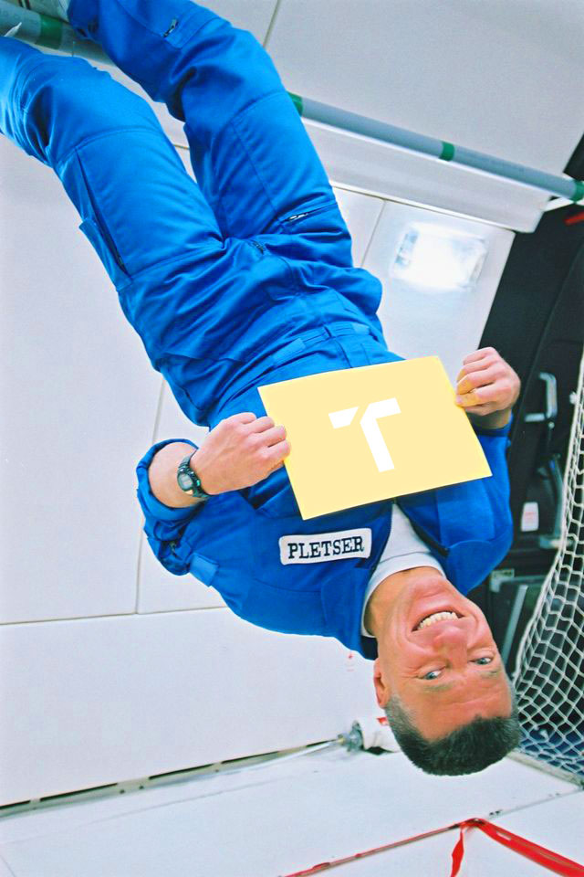 Man in aircraft floating upside down