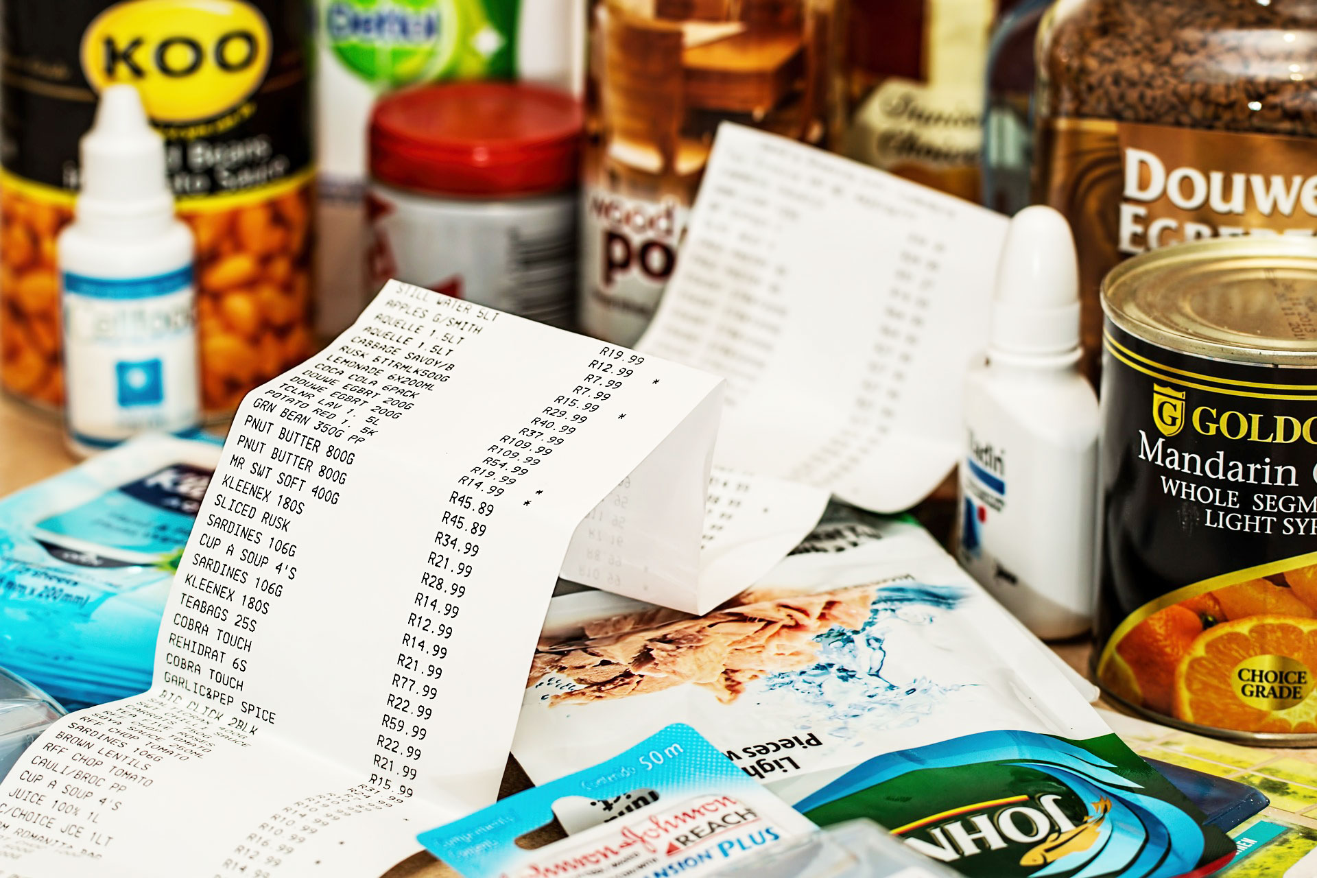 An image of a grocery receipt and grocery items