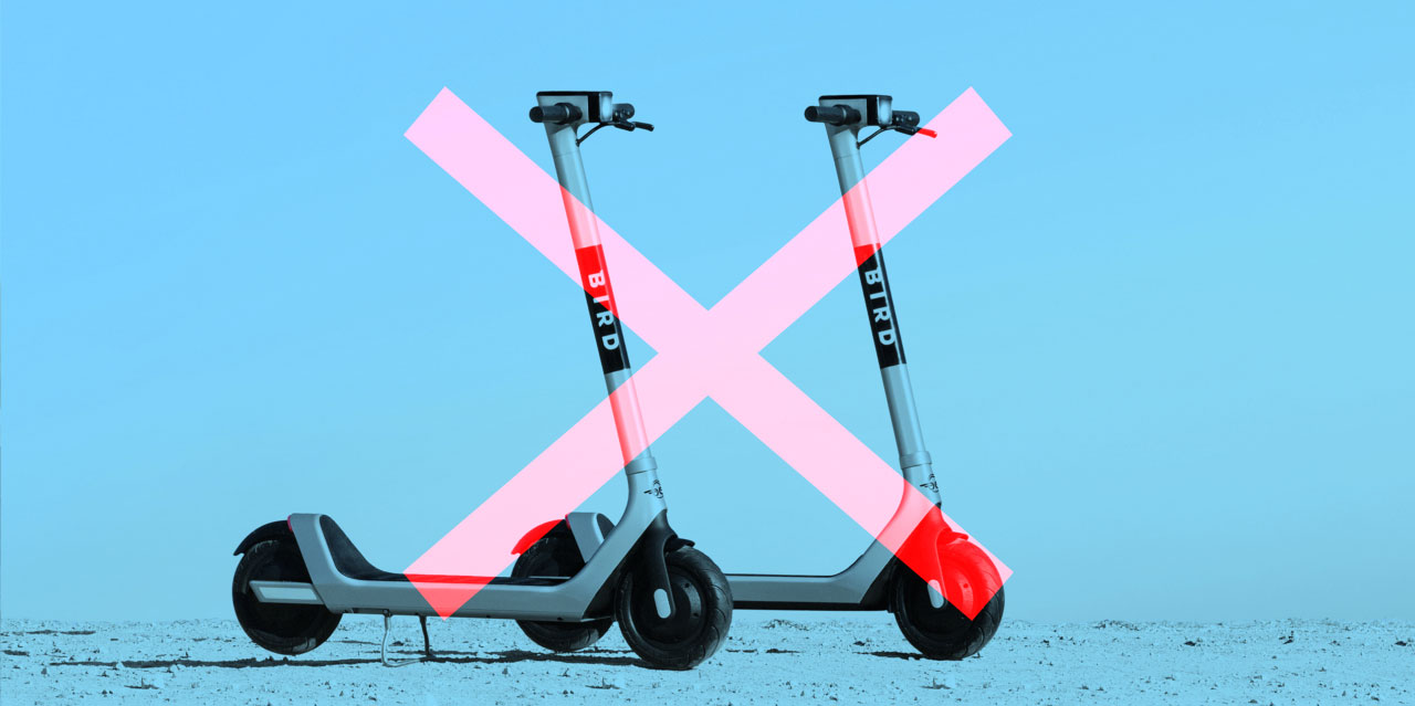 An image of bird scooters overlaid with a red X