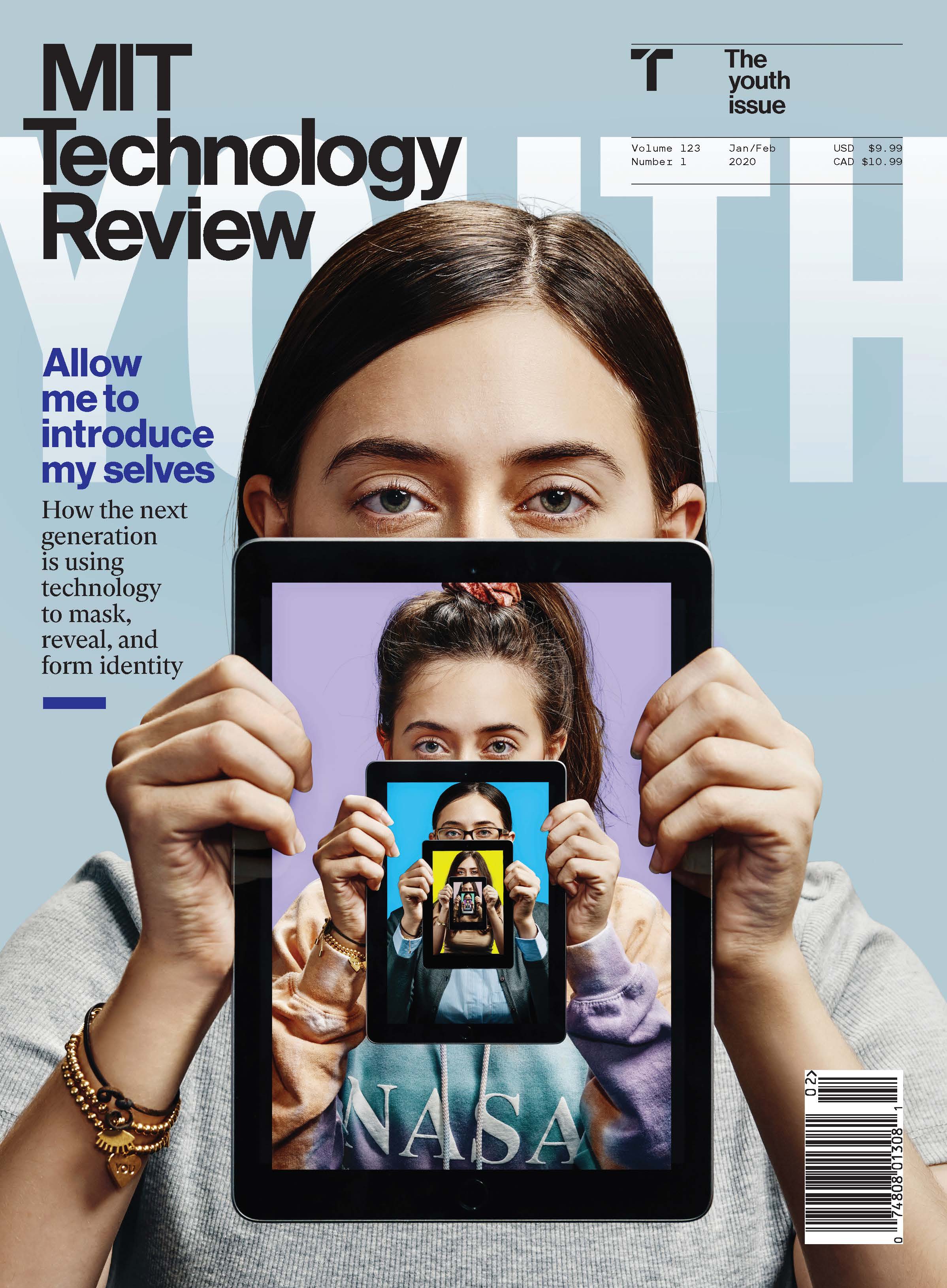 "MIT Technology Review" written in white letters on a light blue background and a photo of a woman holding an iPad.