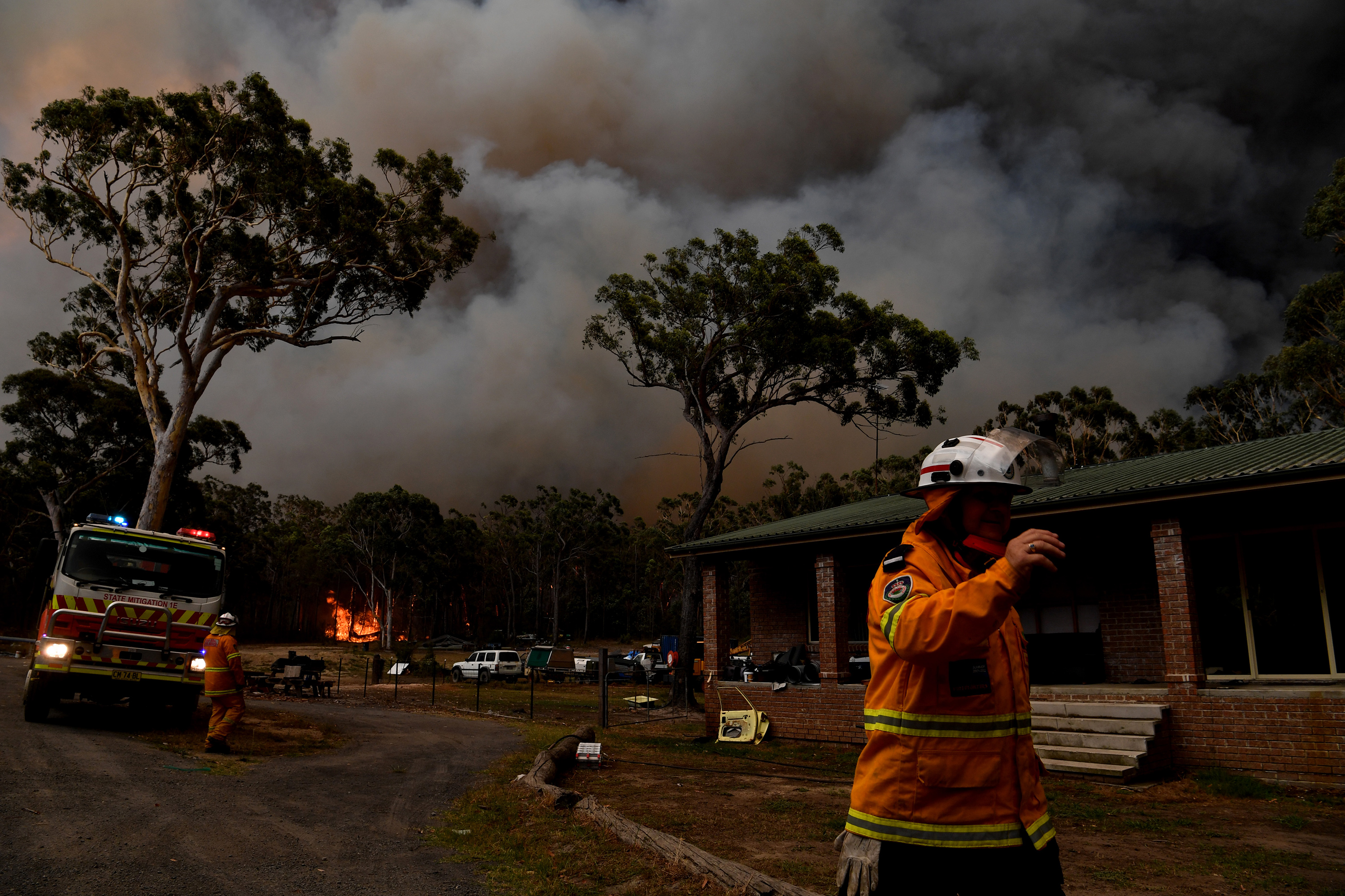Rural Fire Service firefighters battle blazes near the town of Sussex Inlet in late December.