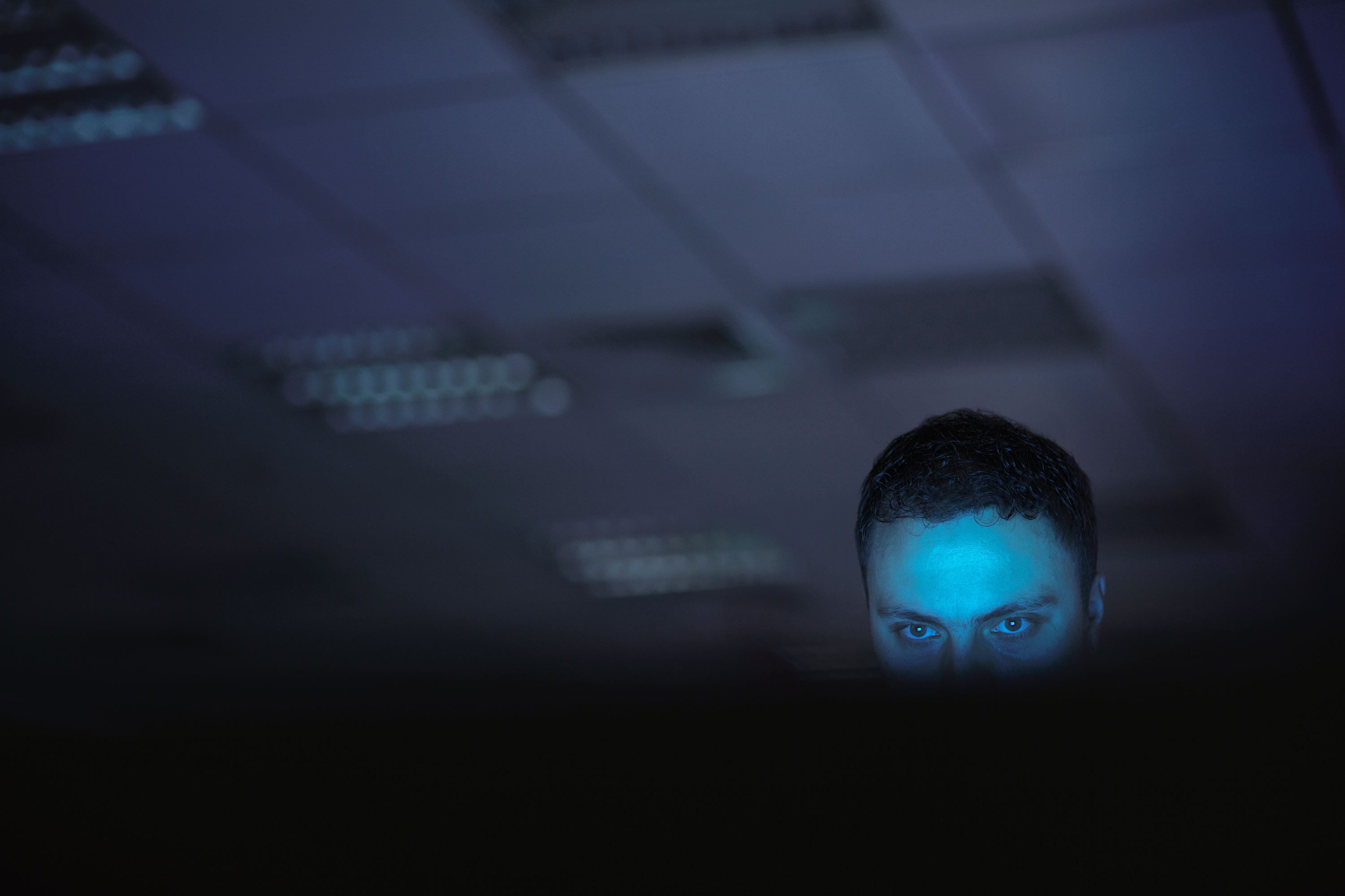 man with blue light on his face searching internet reddit manosphere incel pick up artist mens rights gab toxic