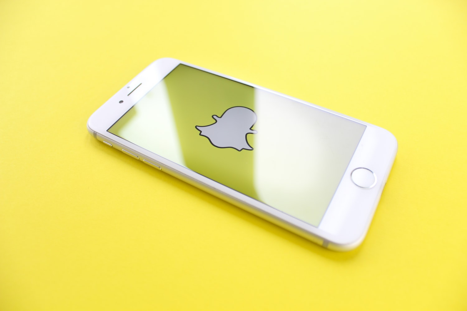 snapchat ghost icon on phone with yellow background snap here for you mental health depression anxiety suicide teen facebook instagram twitter pinterest