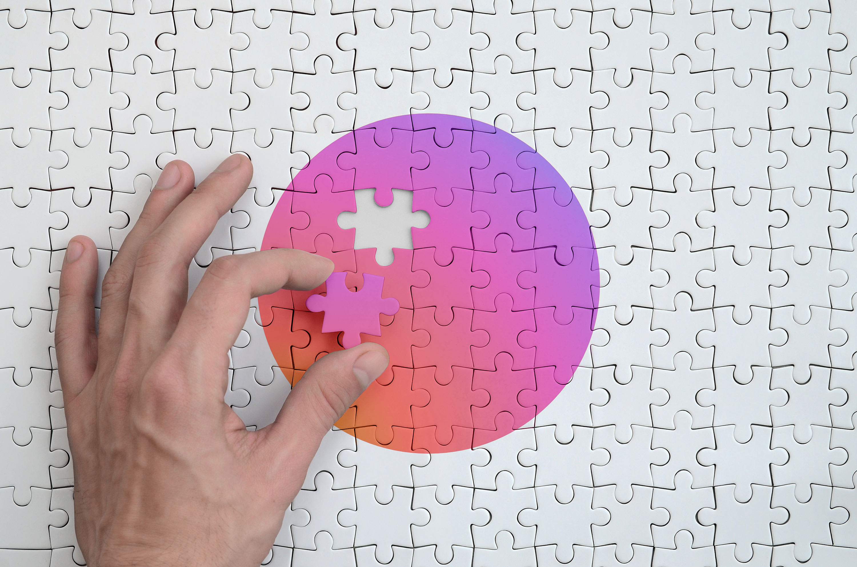 image of hand placing gradient puzzle piece instagram colors