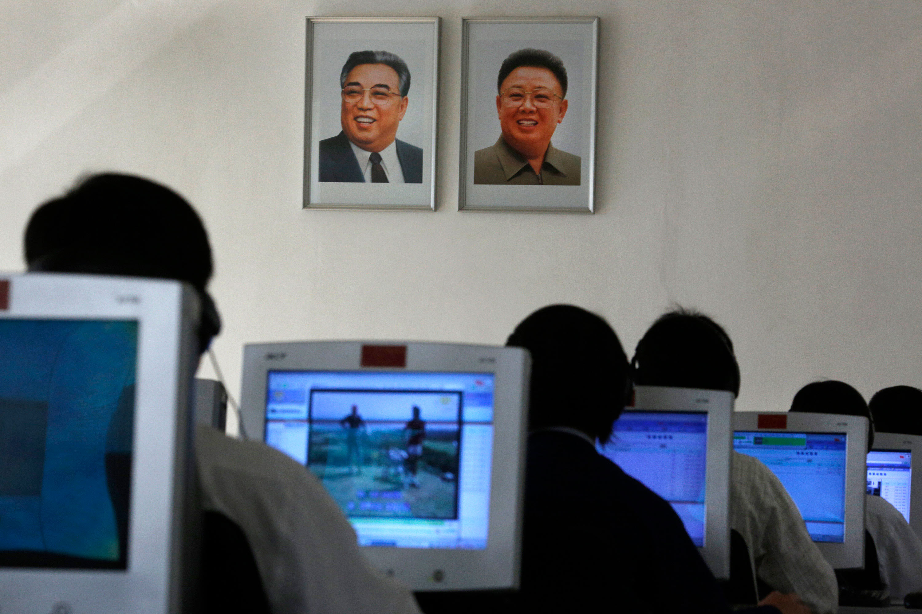 North Korean students use computers near portraits of the country&#039;s later leaders Kim Il Sung, left, and his son Kim Jong Il at the Kim Chaek University of Technology in Pyongyang, North Korea.