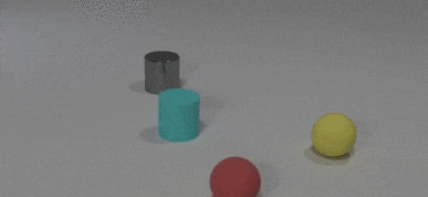 A red rubber ball hits a blue rubber cylinder that continues on to hit a metal cylinder.