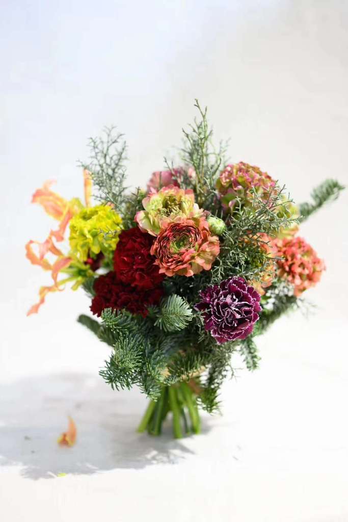 An arrangement of pon pon flowers.