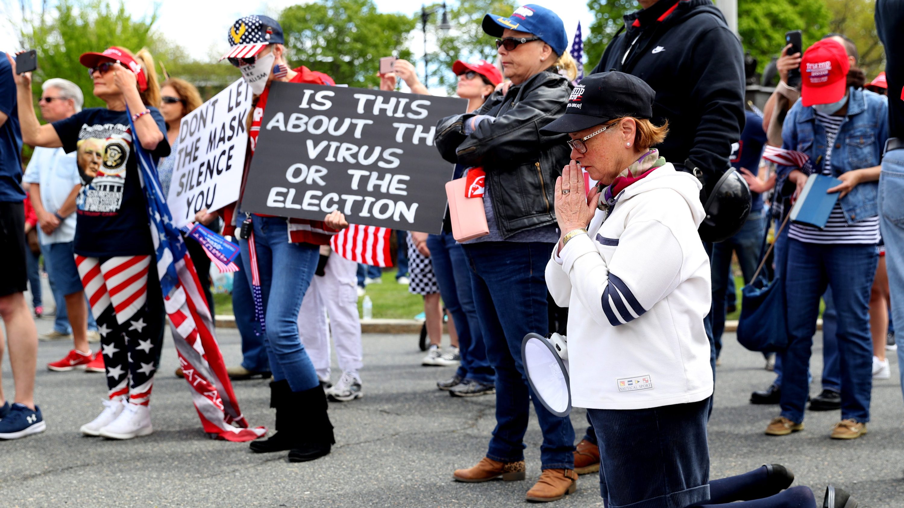 Protestors ask Massachusetts Governor Baker to reopen.