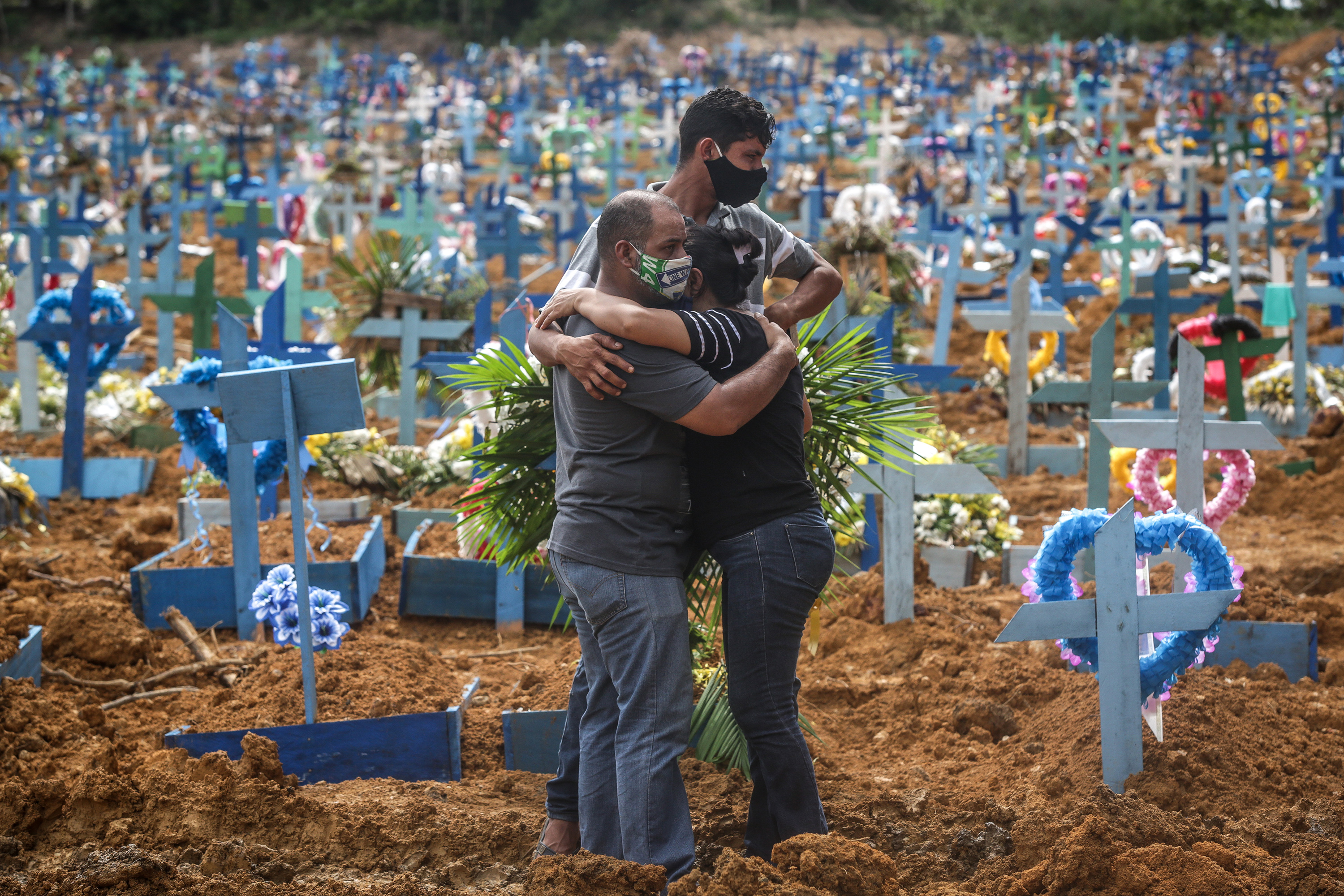 Bereaved at coronavirus graves in Manaus