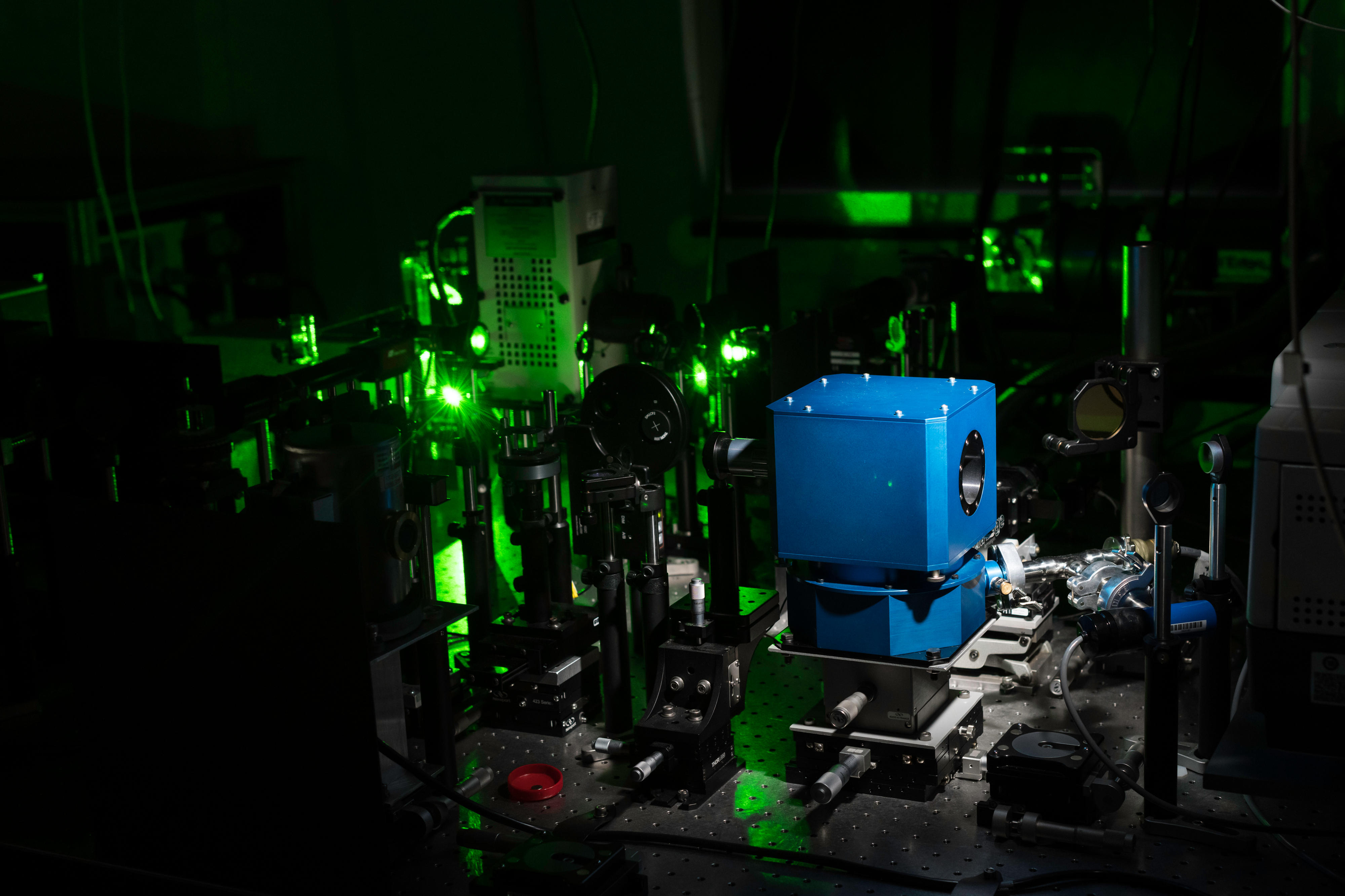 Equipment used to create a room-temperature superconductor, including a diamond anvil cell (blue box) and laser arrays, is pictured in the University of Rochester lab of  Ranga Dias.