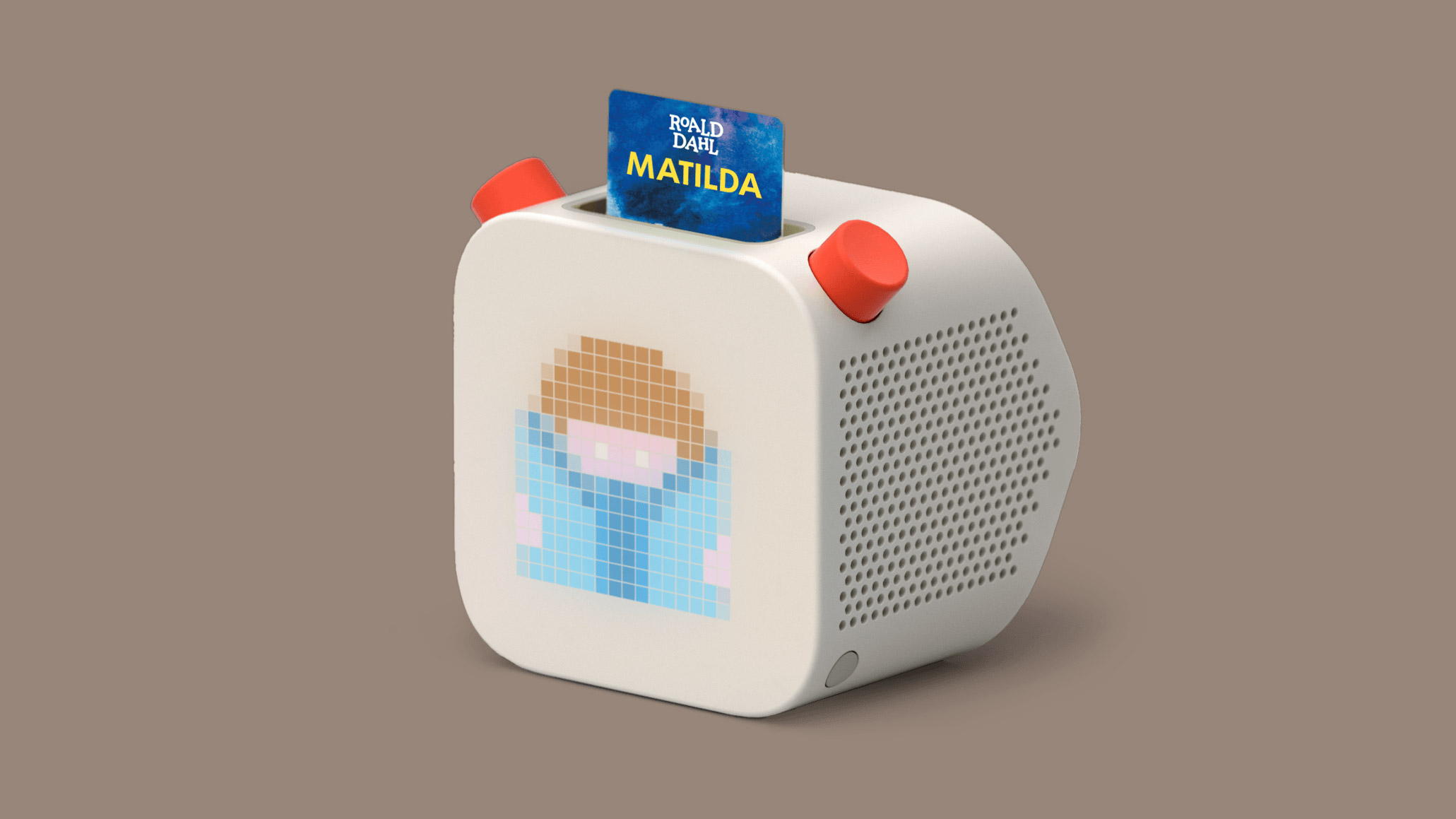 image of white radio looking box with a slot inserted that reads matilda yoto audio device for kids