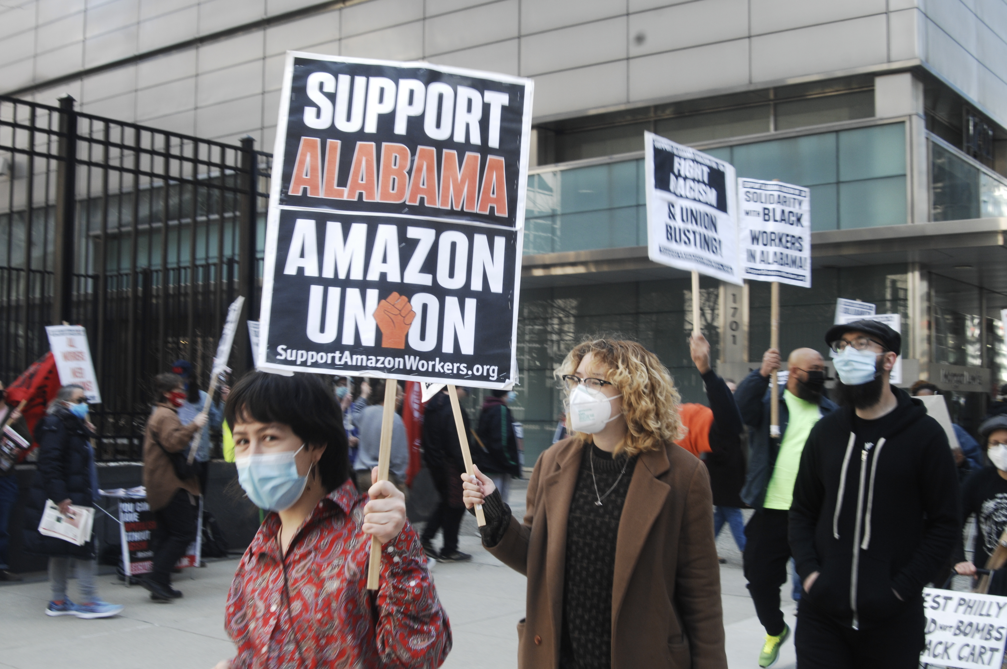 Philadelphia workers picket in front of the law office of Morgan and Lewis, the union-busting firm hired by Amazon to break the unionizing efforts of workers in Bessemer, Alabama