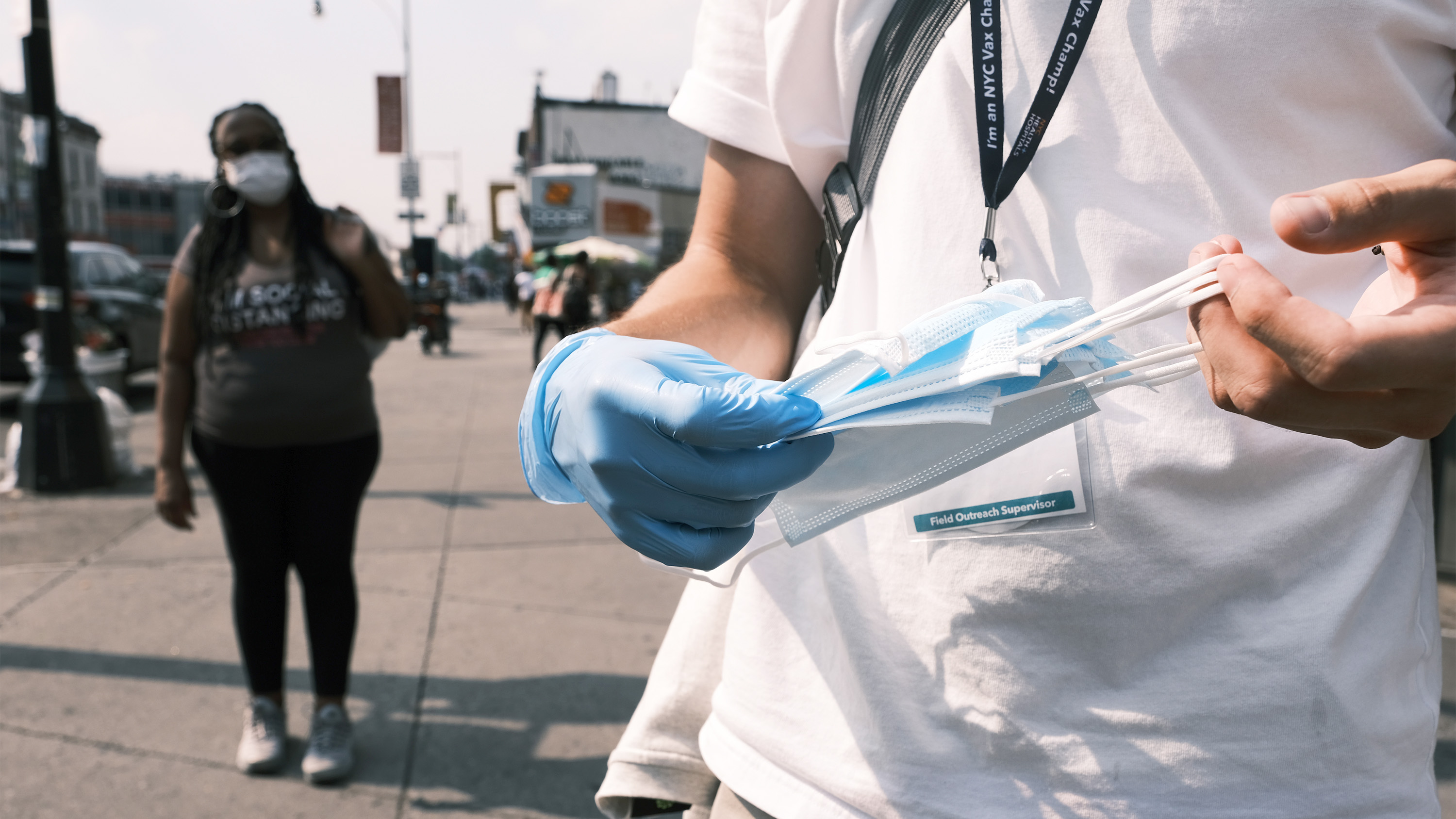 Test and Trace Corps walk the streets of Brooklyn passing out masks