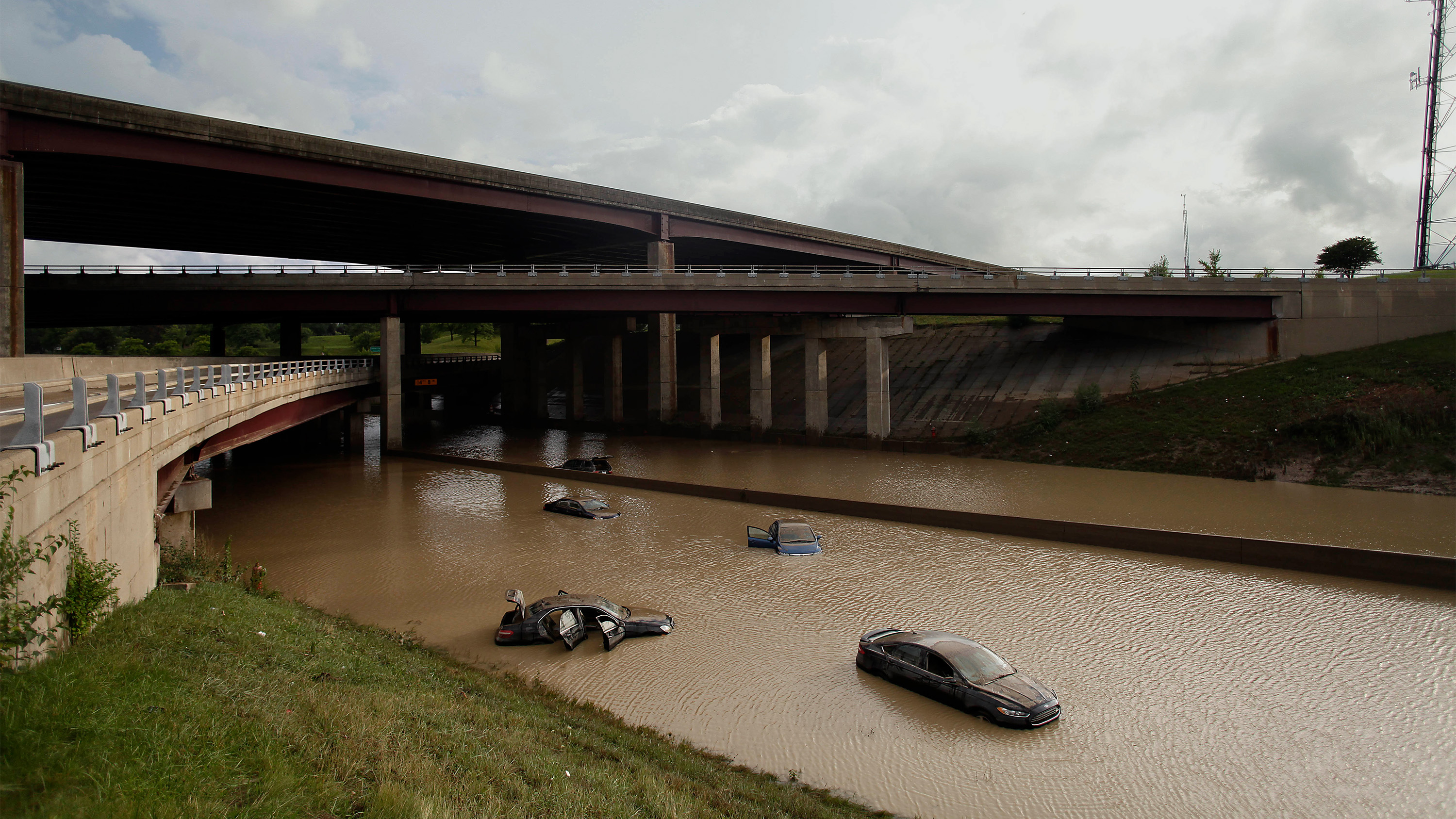 abandoned vehicles on flooded highway near Detroit