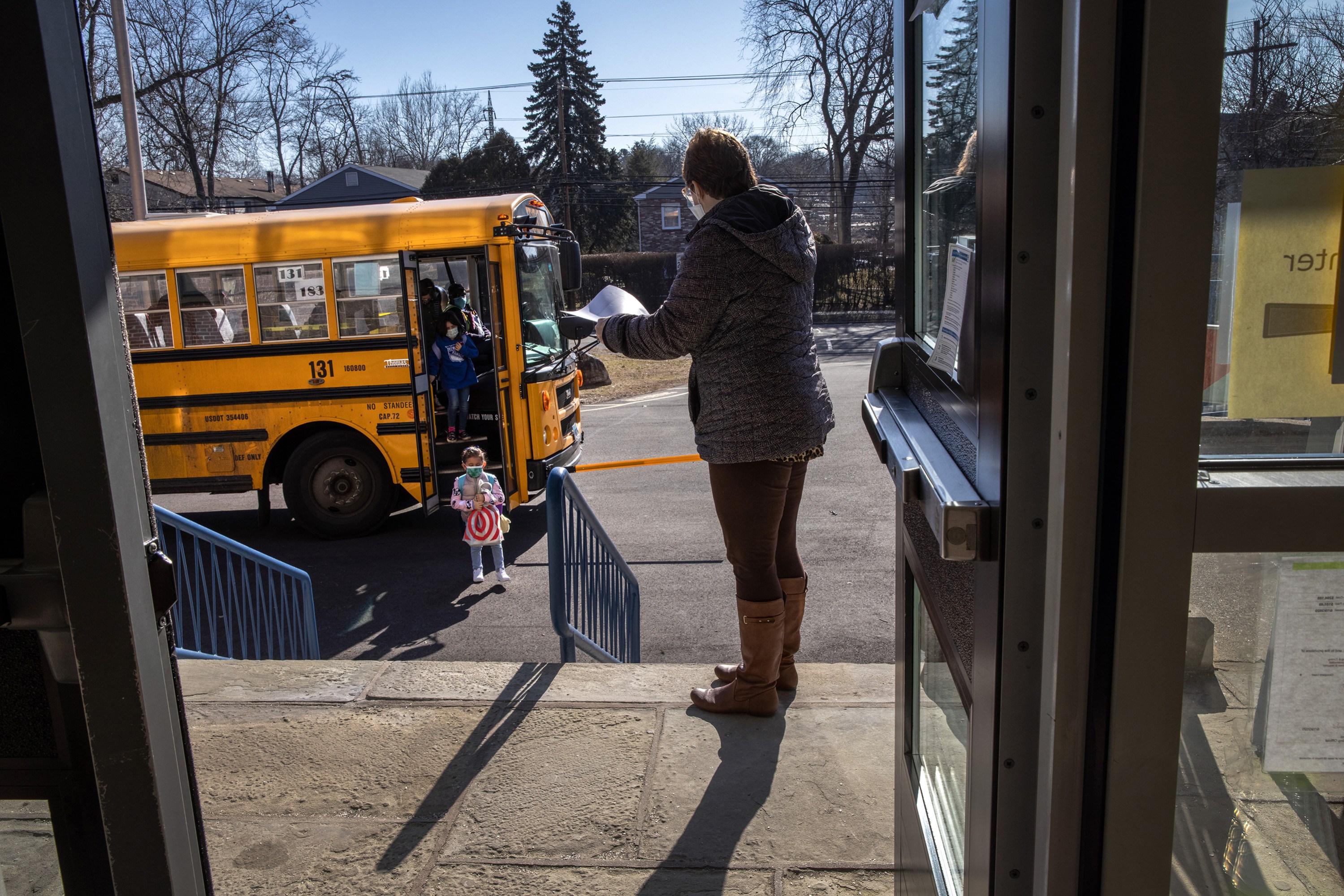 kids return to school on bus