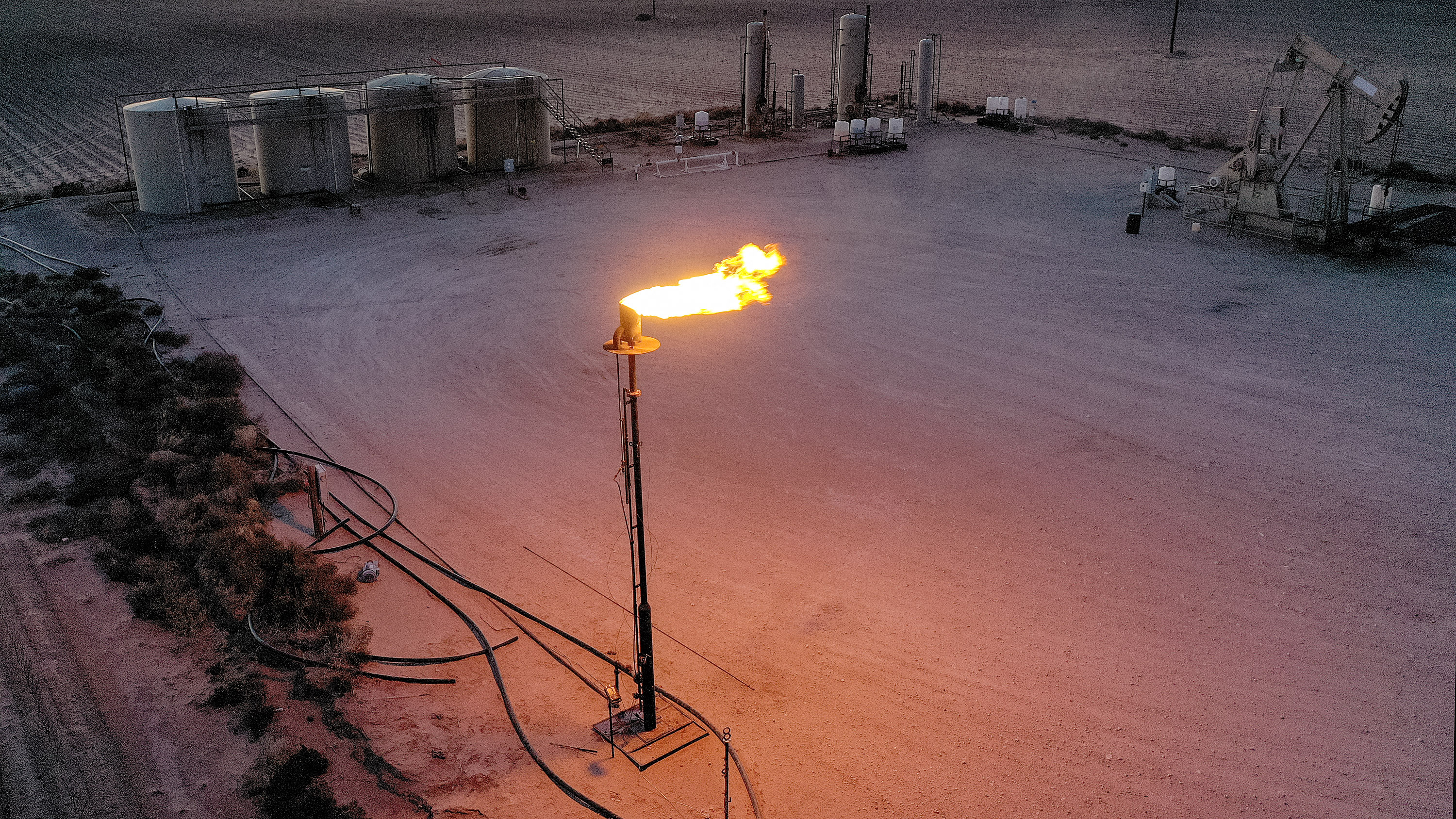 natural gas is flared off during an oil-drilling operation in the Permian Basin oil field