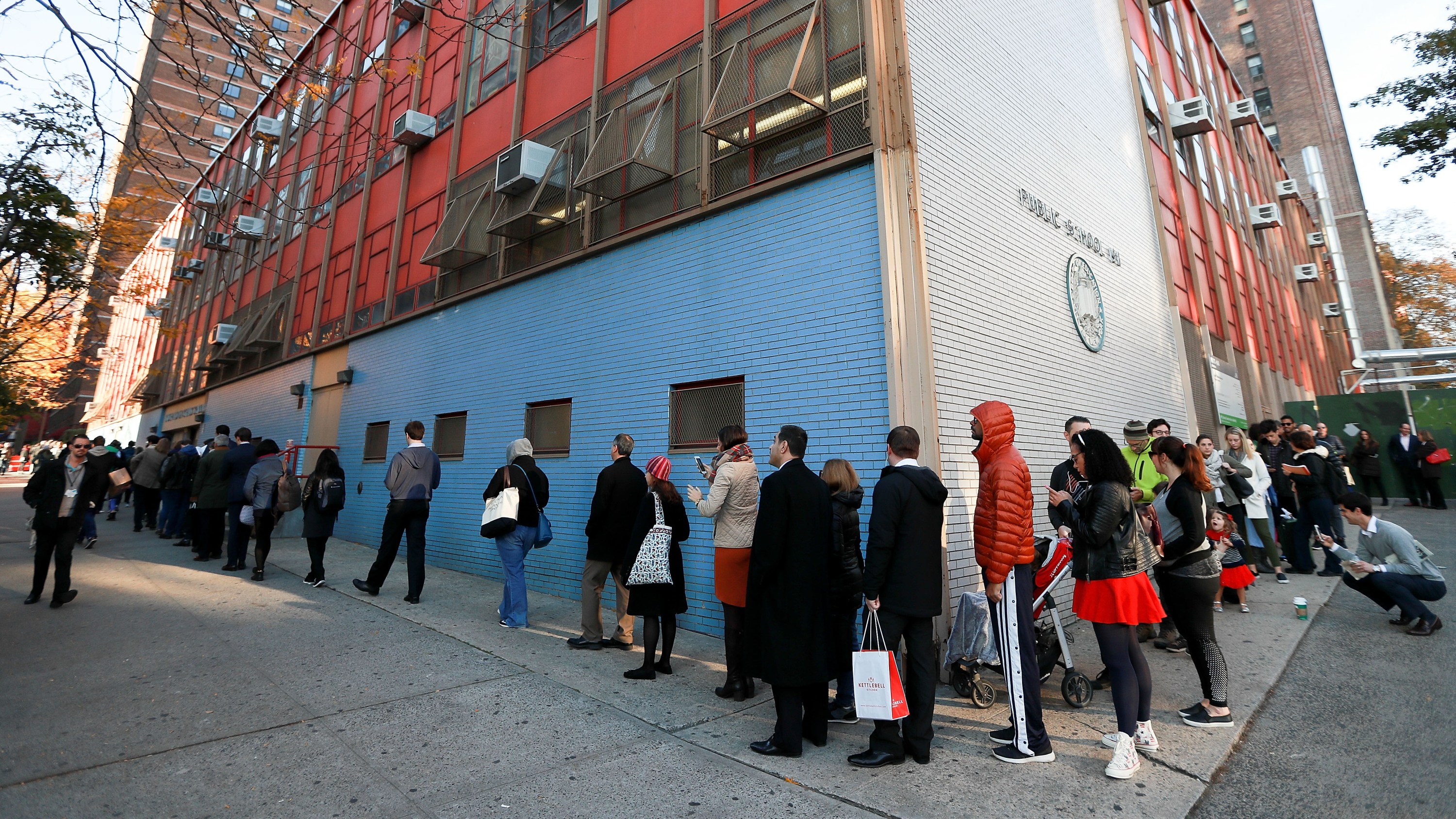 ines of voters wrap around the outside of PS198M The Straus School as they wait to cast their ballots