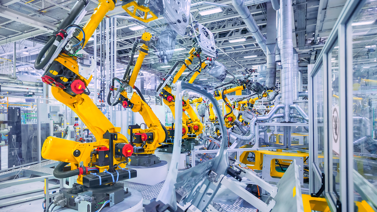 stock image of robots in a car plant