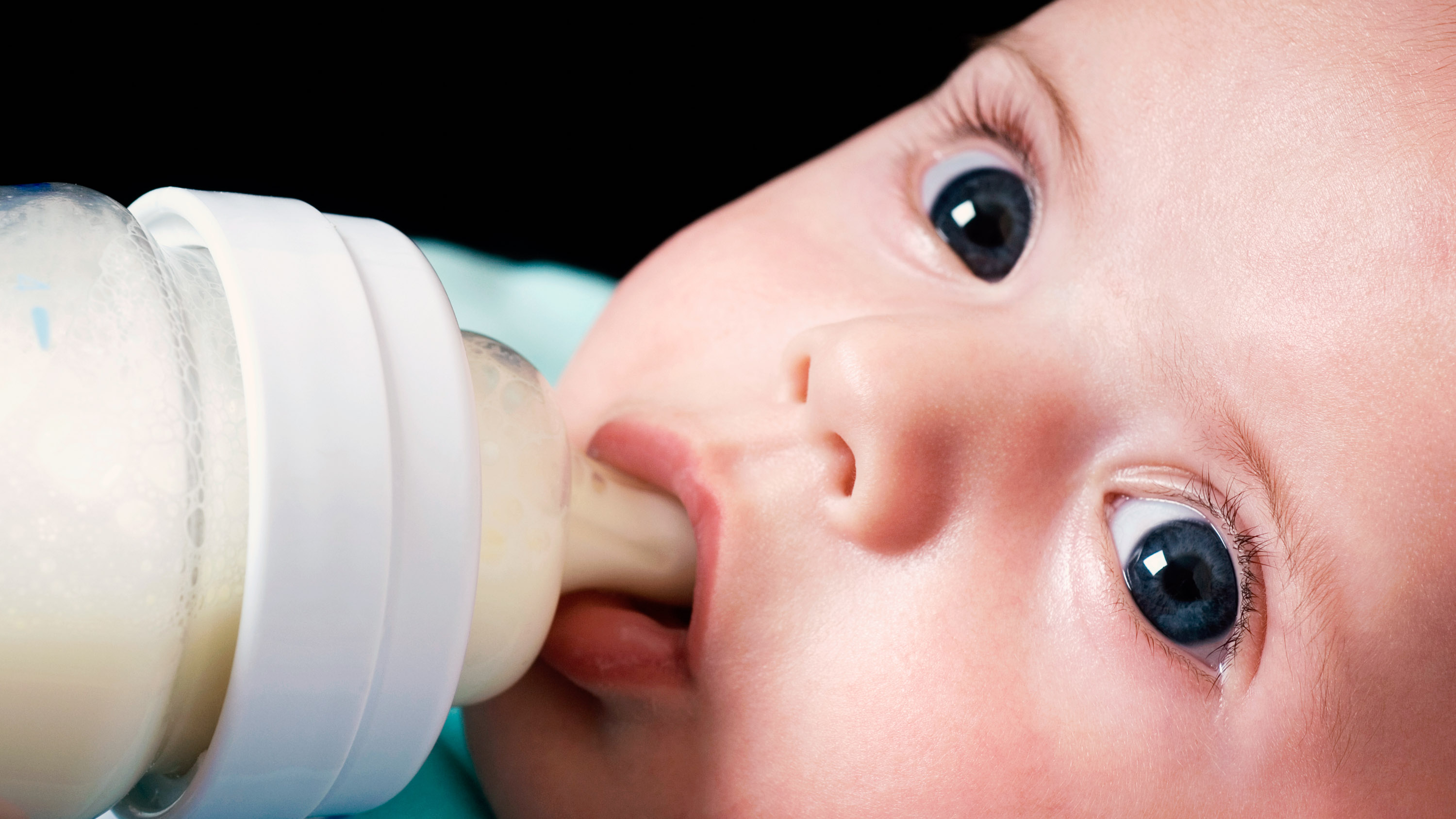 close up of baby with a bottle