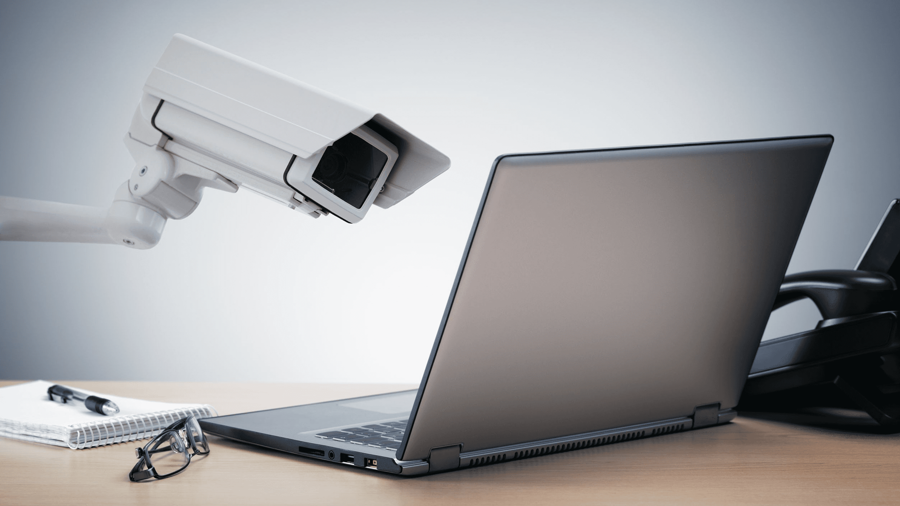 stock art of a security camera pointed at a laptop