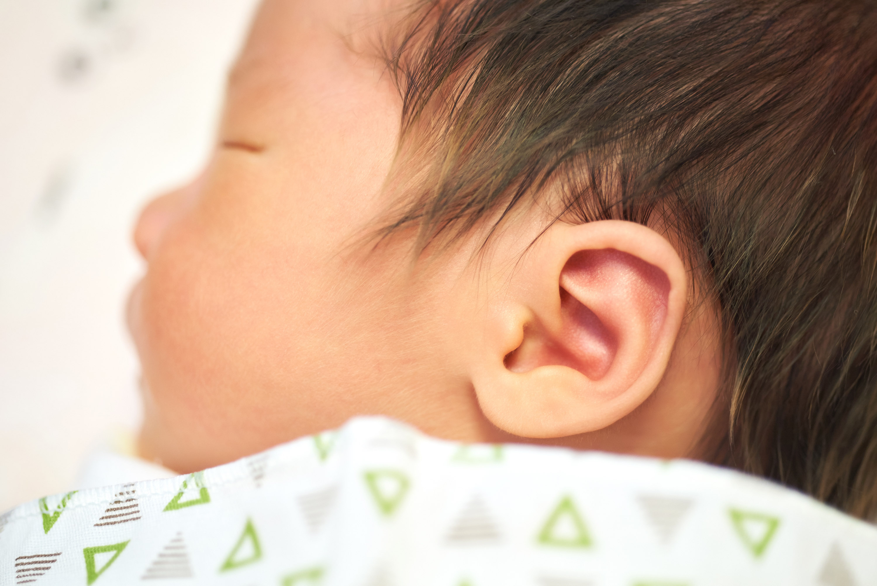 close up view of a sleeping baby from the side