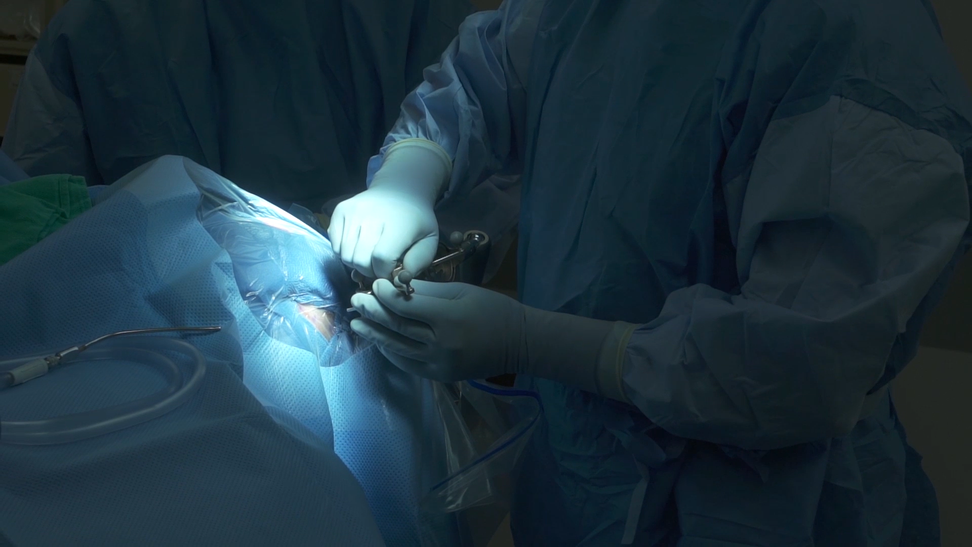 doctor surgically implanting a memory prosthetic