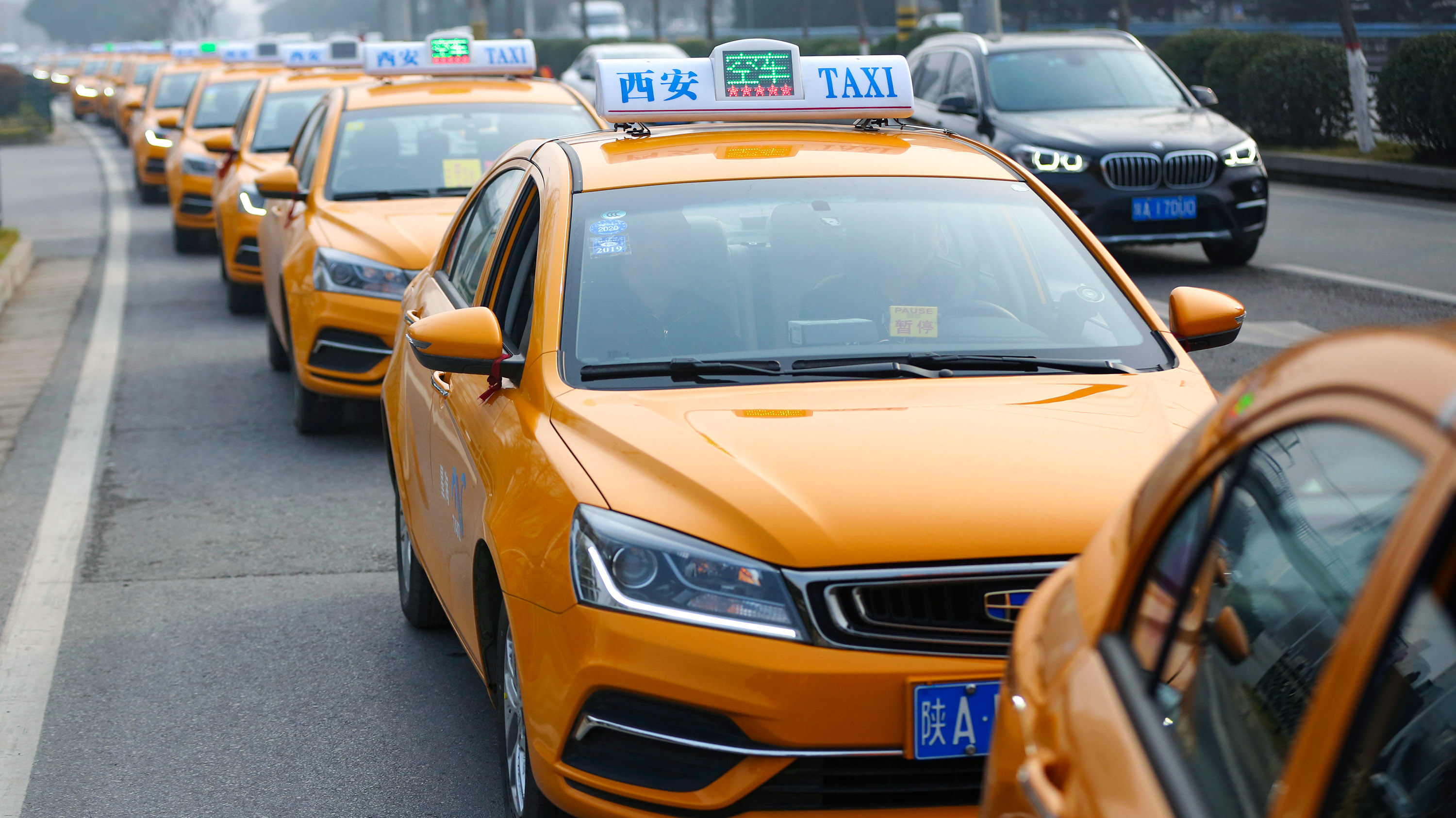a queue of methanol taxis on a road in Xi&#039;an city, China