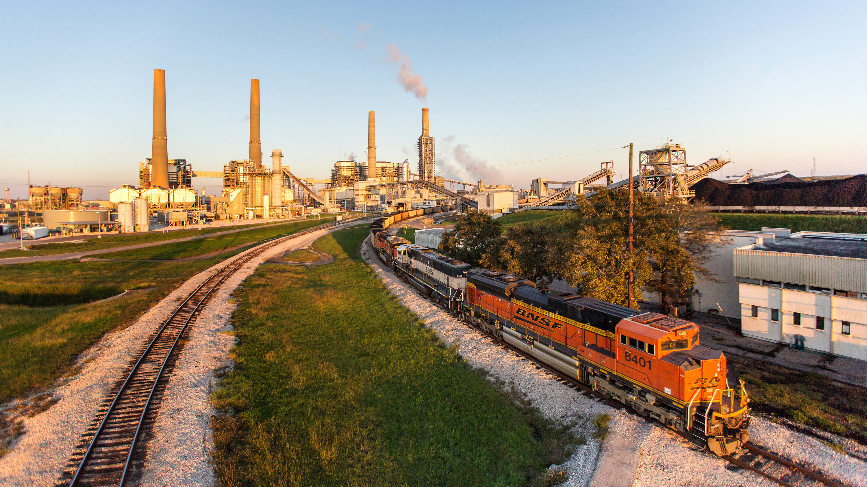 Petra Nova plant at magic hour with train in foreground