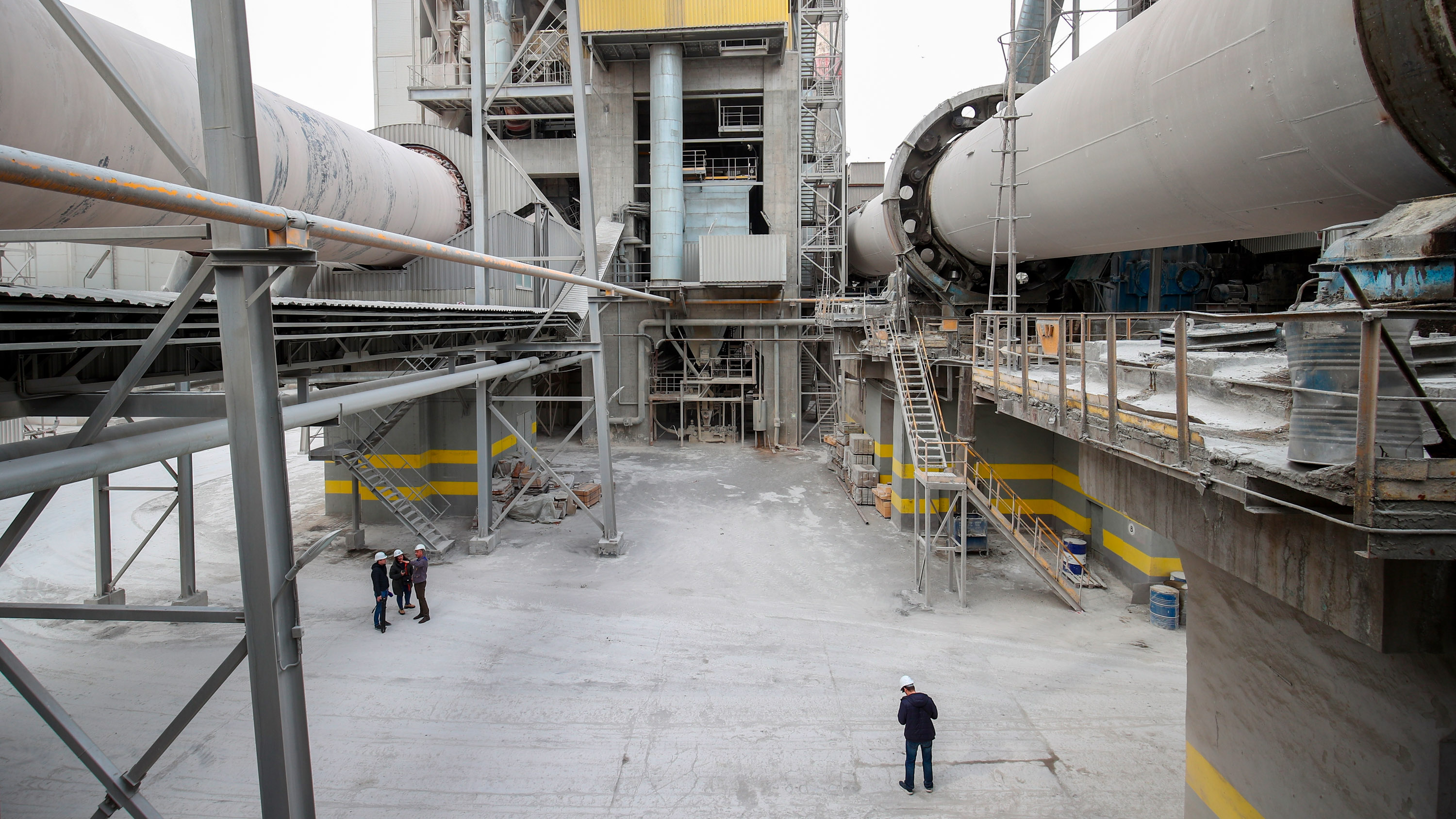 view of workers below at a cement factory in Russia