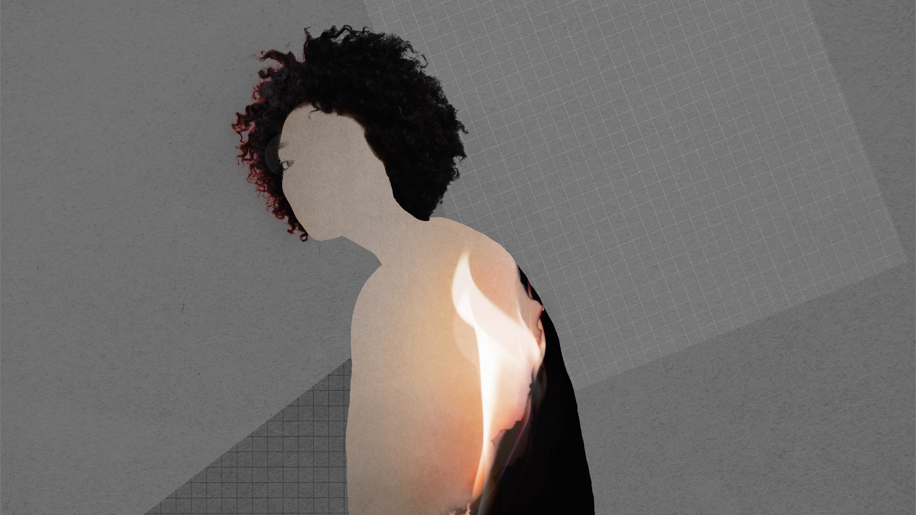 silhouette of a woman made with burning paper