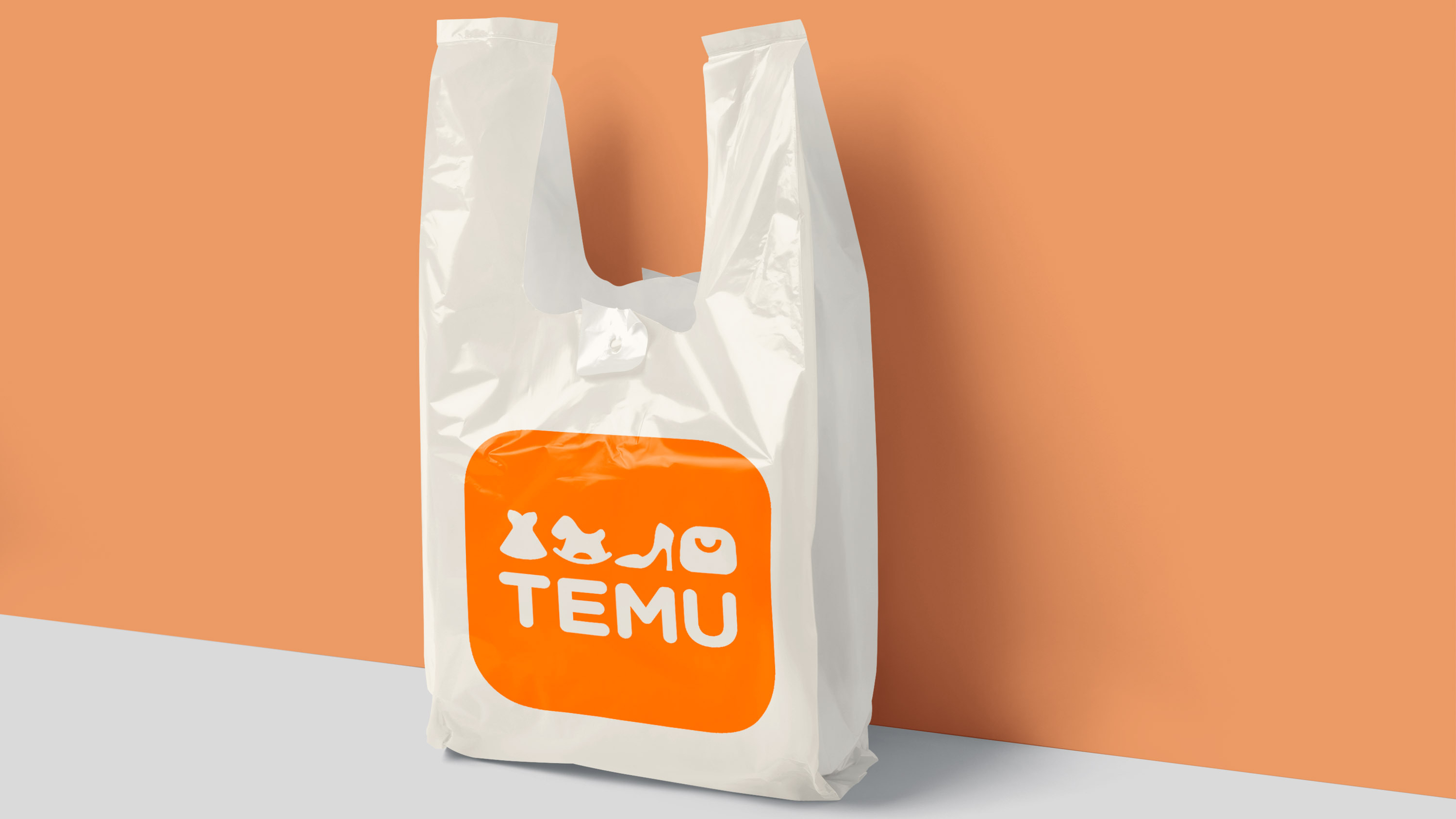 A plastic shopping bag with Temu&#039;s logo on it.