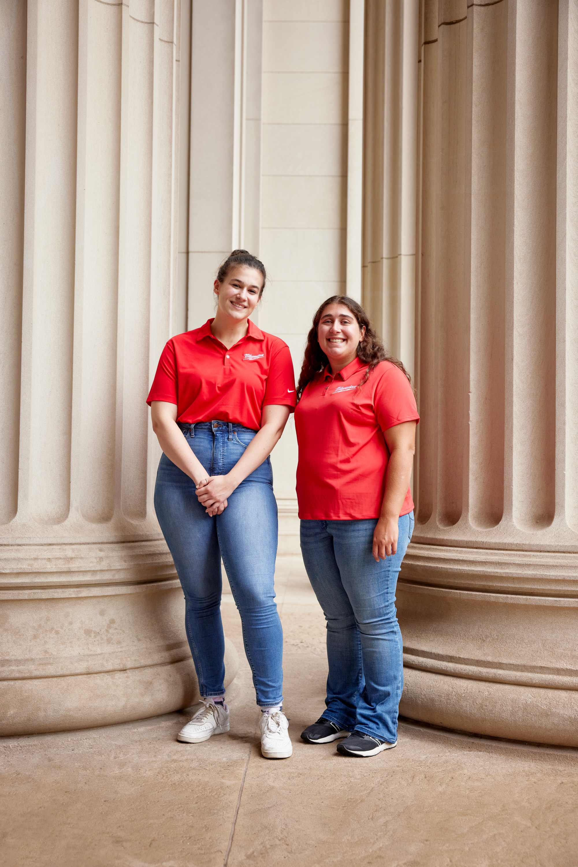 Rosalie Phillips and Beth Cholst standing in front of columns.
