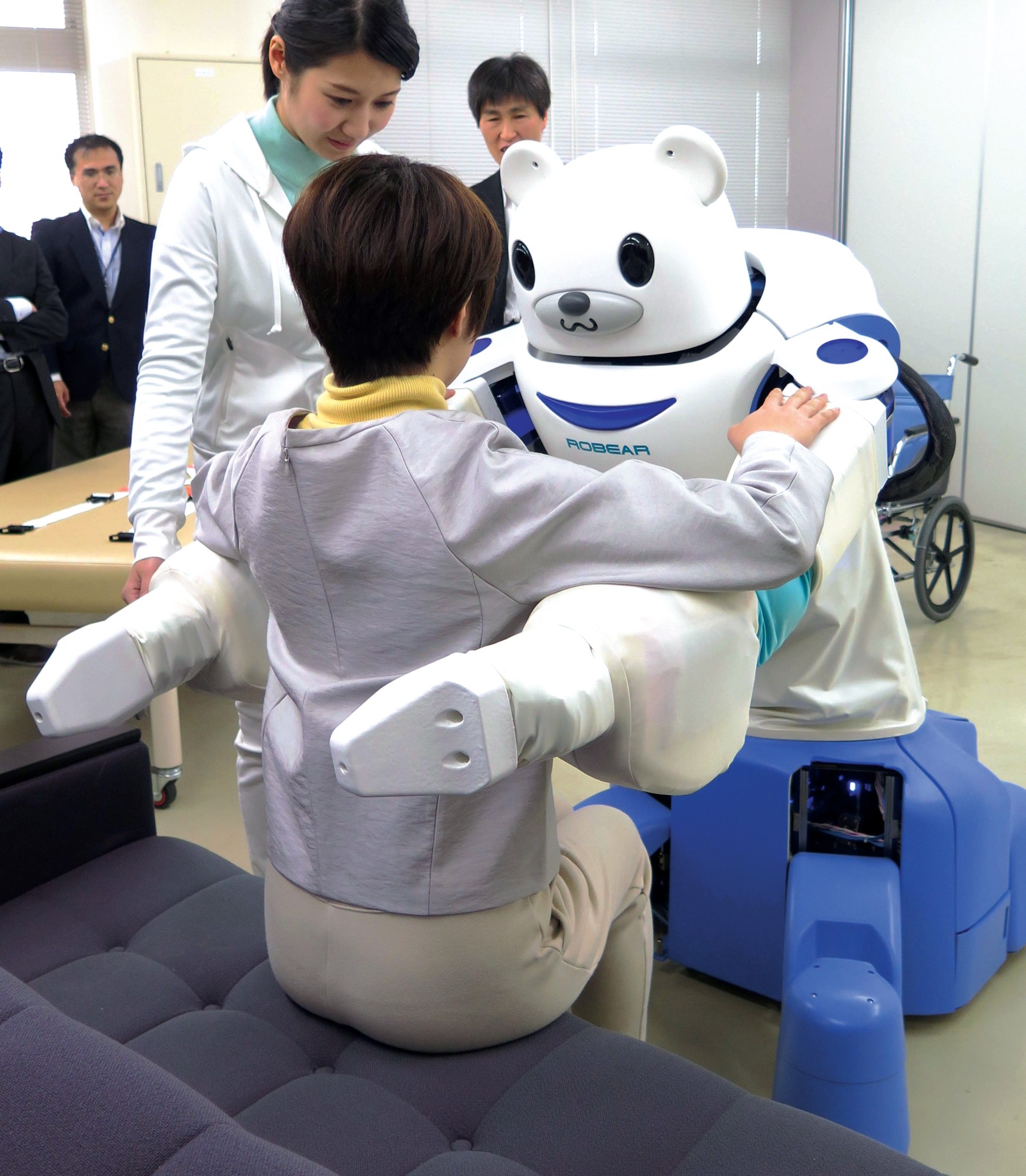 Robear is ready to lift a person during a press demonstration.