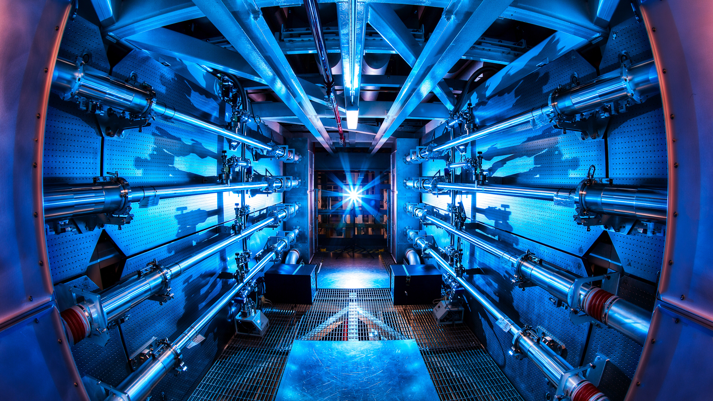 futuristic image of a nuclear fusion reactor, with a starburst light in the center of the image