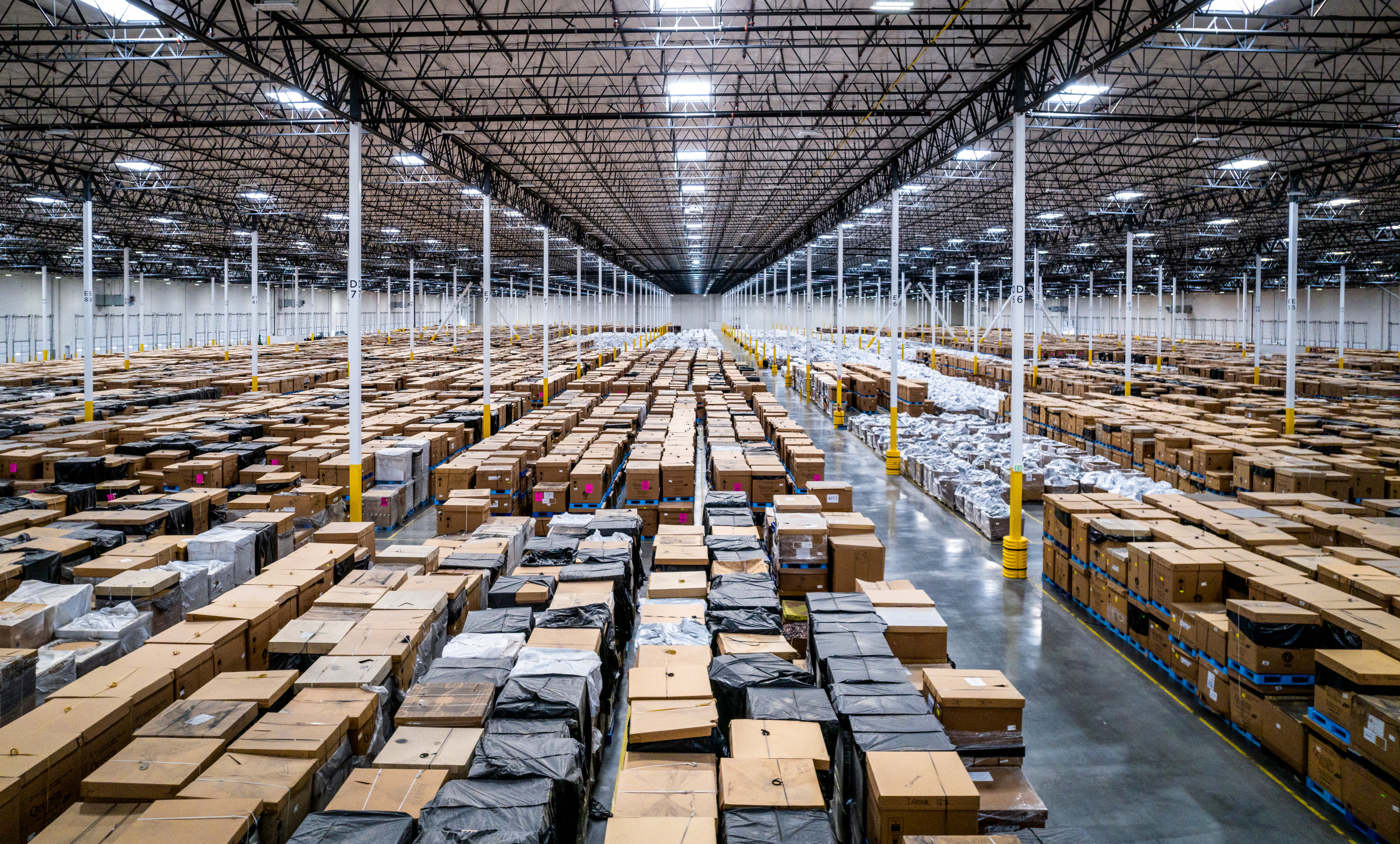 overview of a warehouse filled with rows of cardboard boxes