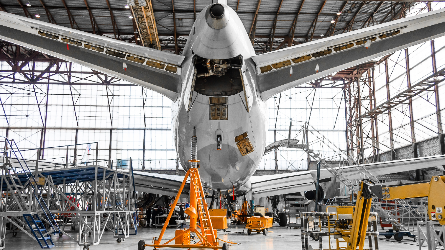 Stock image of an airplane in an airplane hanger