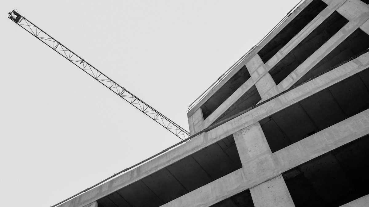 View of a brutalist-style building from below, in black and white