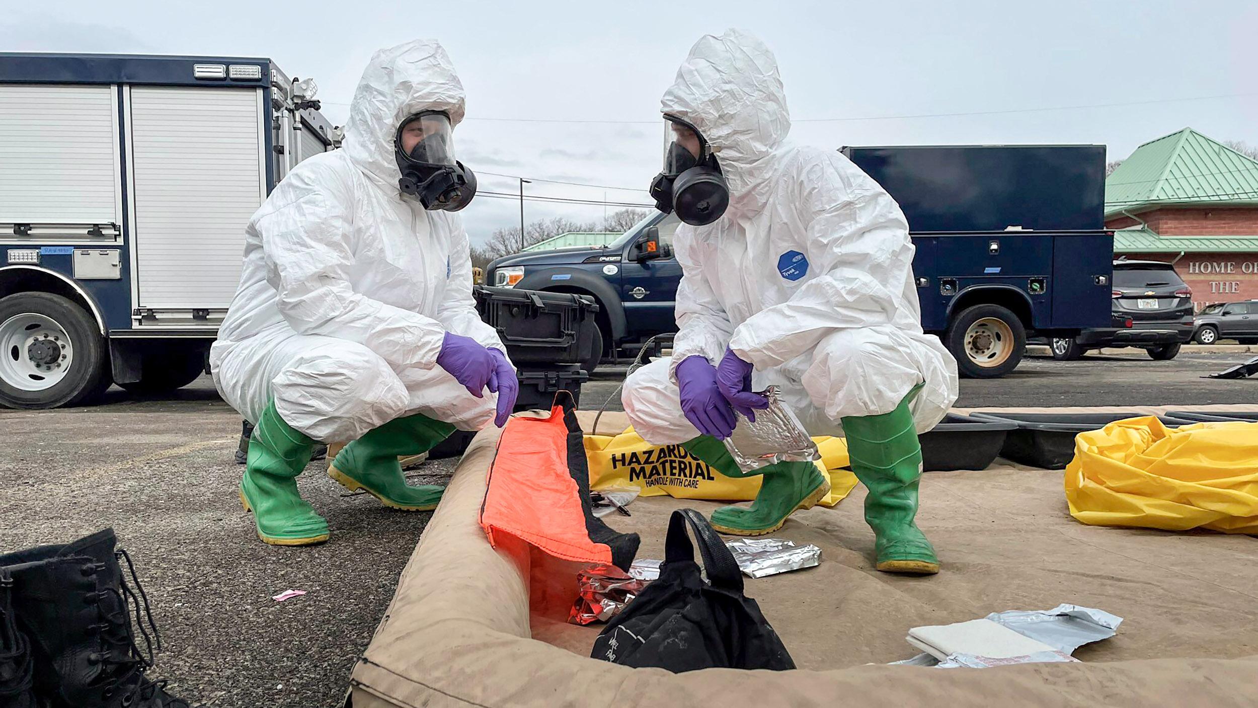 ONG 52nd Civil Support Team members prepare to enter an incident area to assess remaining hazards with a lightweight inflatable decontamination system (LIDS) in East Palestine, Ohio
