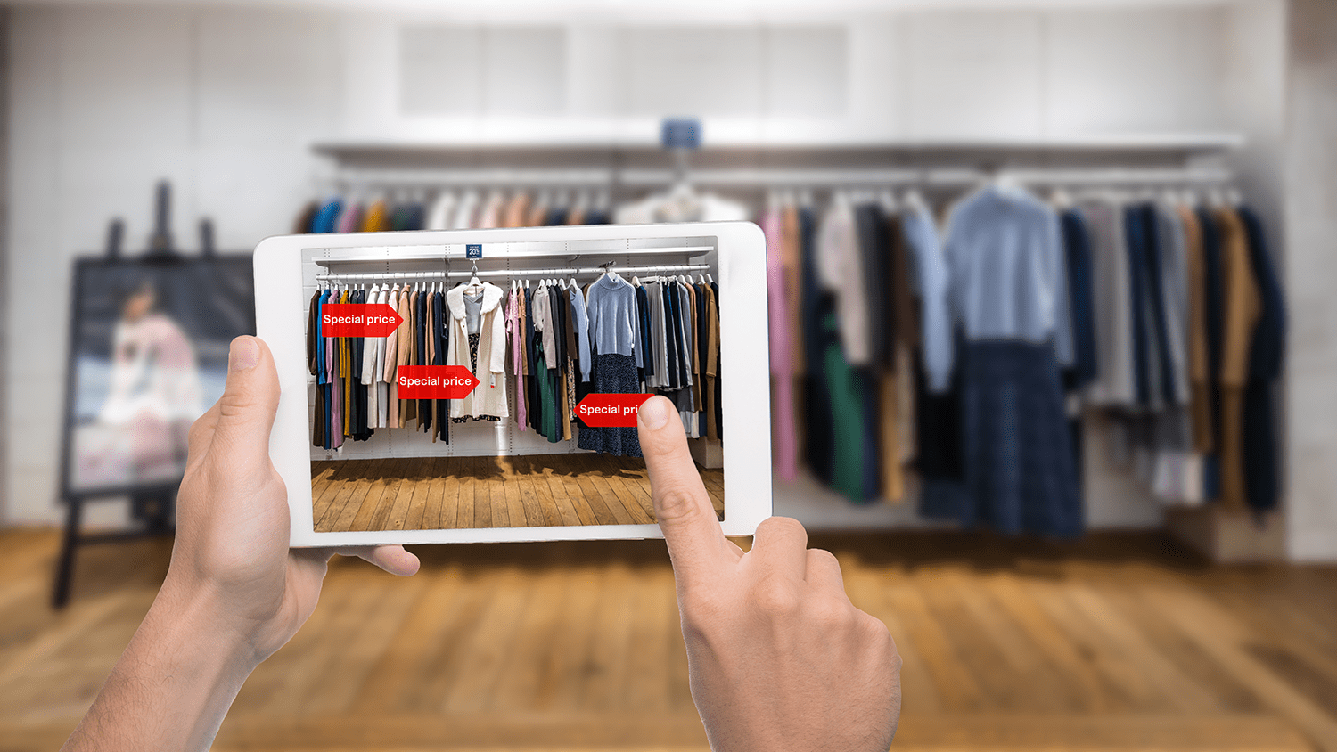 Stock image of a virtual reality app pointed at a clothing store rack, showing prices.