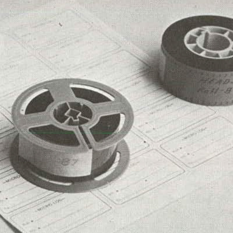 positive print on film reel with edited negative roll behind