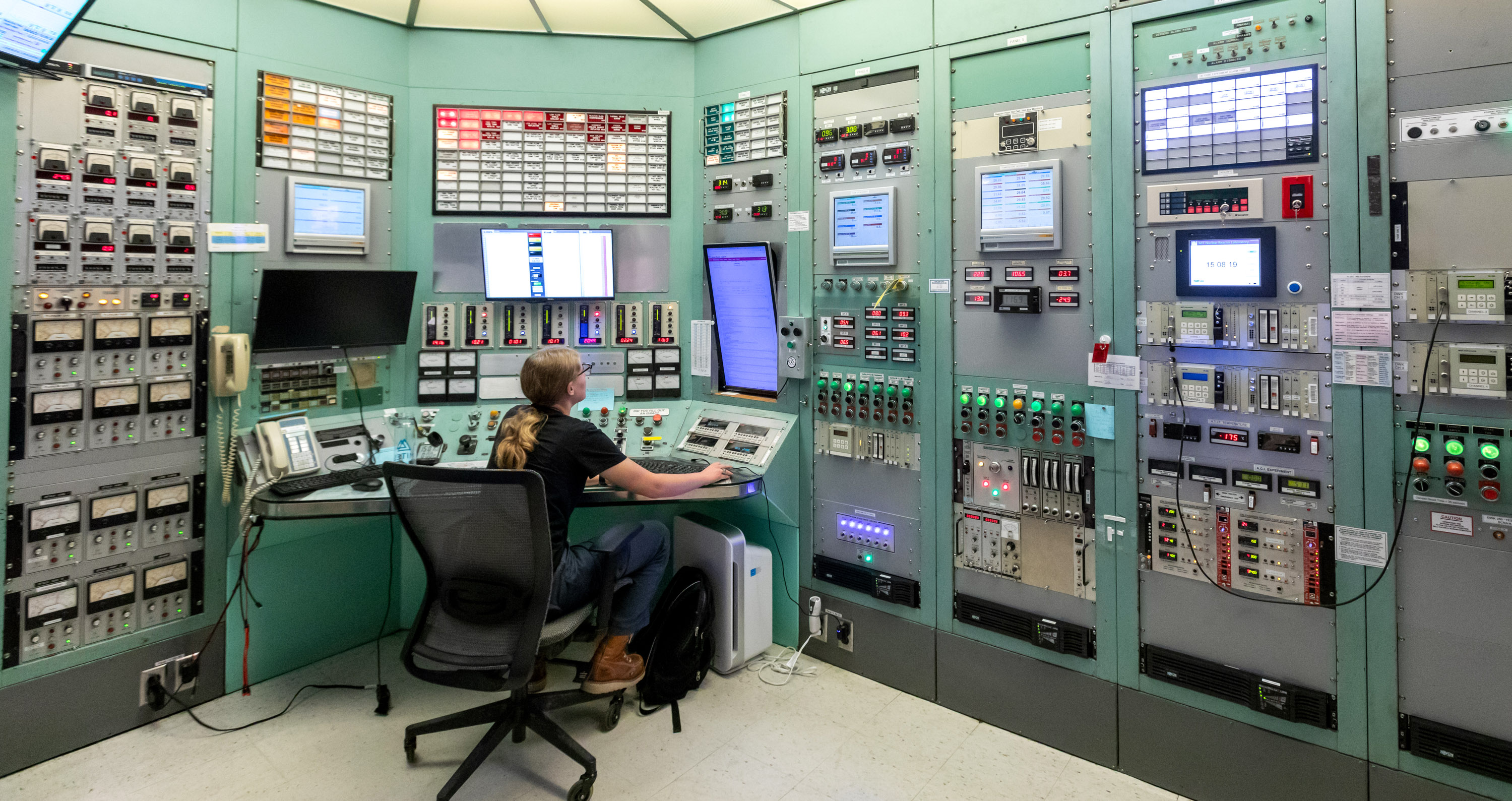 The control room of MIT&#039;s Nuclear Reactor Lab with a student operator on console