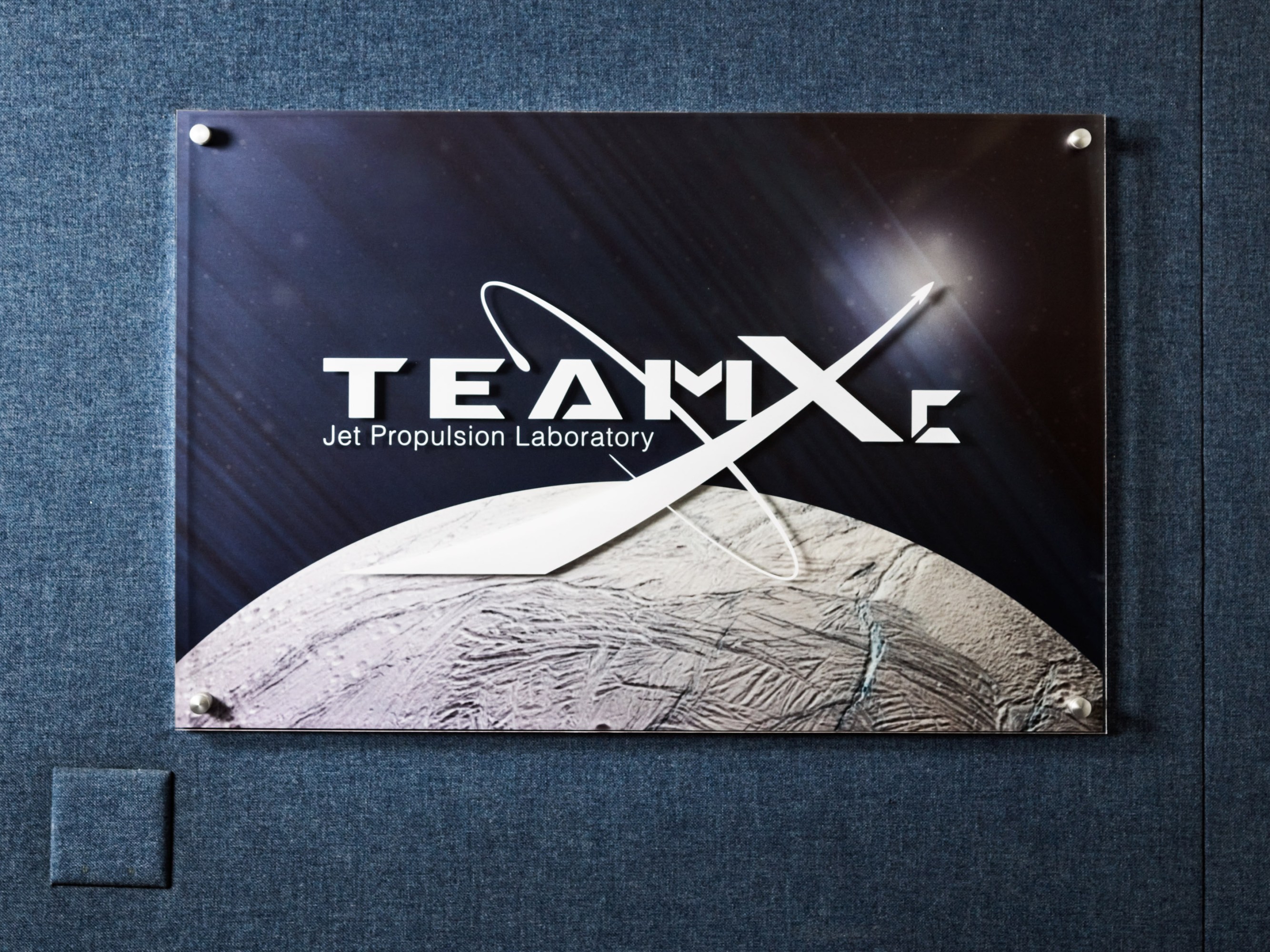 wall poster for Team X at JPL