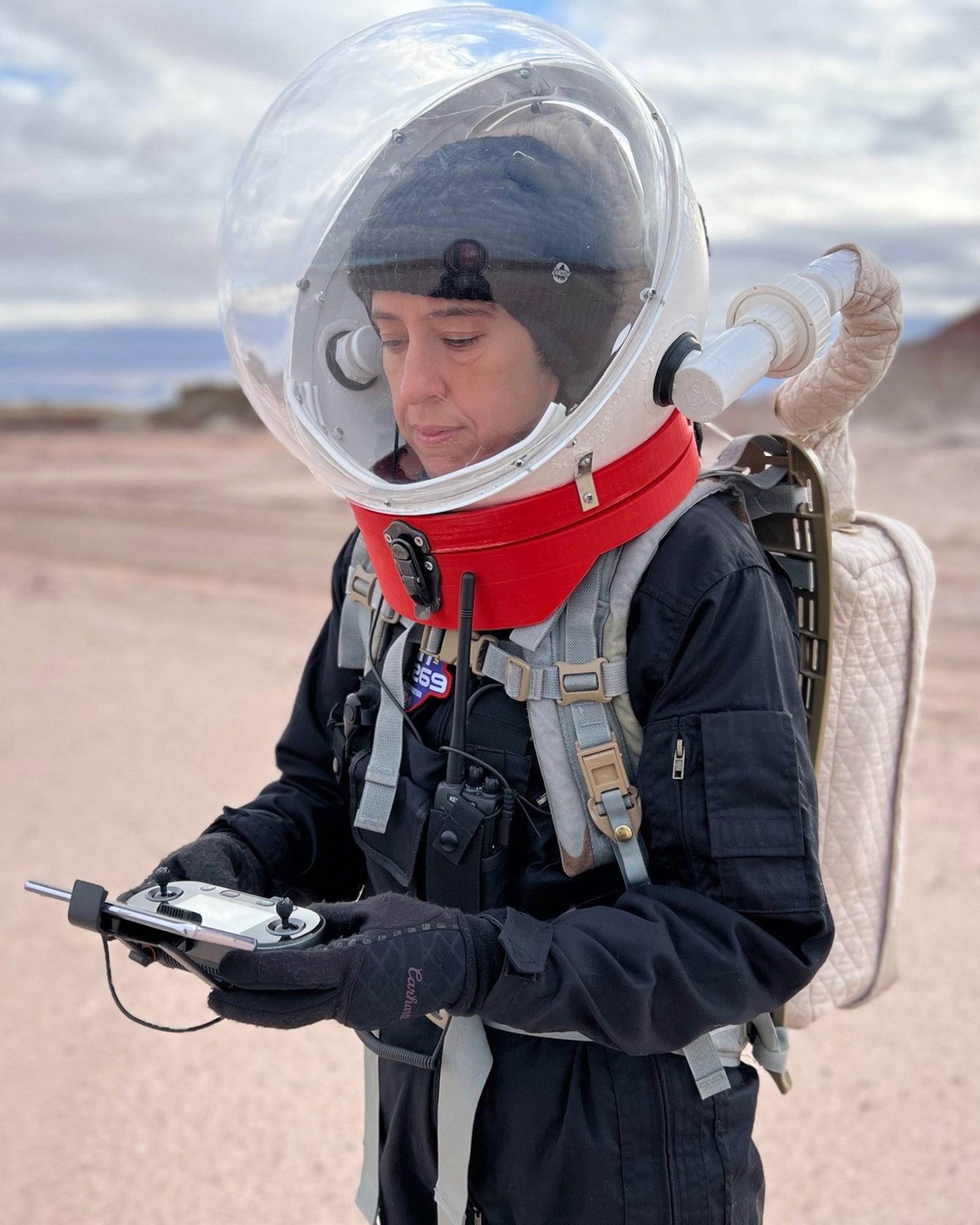 Braun in an analog mission in the desert wearing a spacesuit