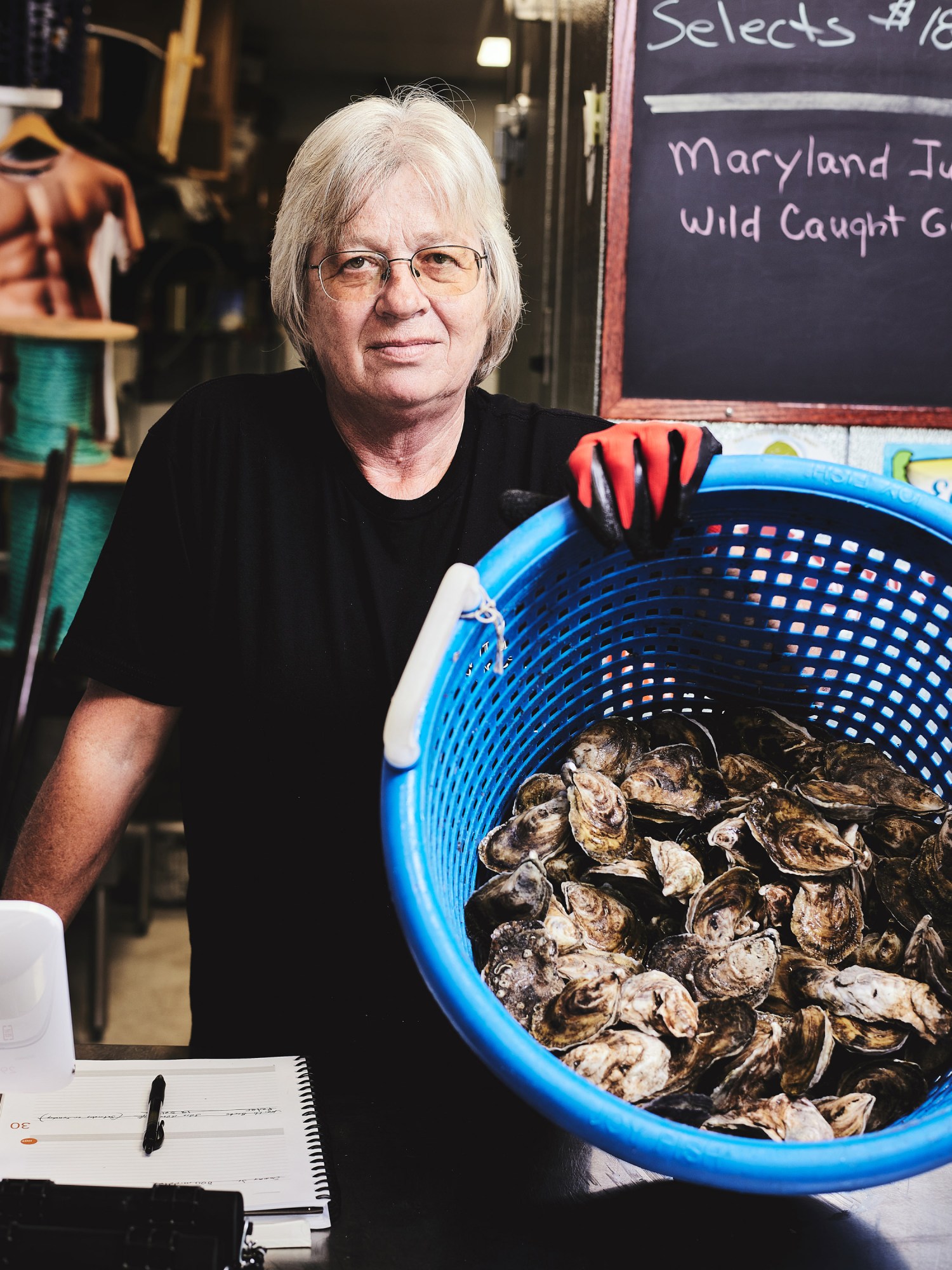 Carol Friend with a basket of oysters