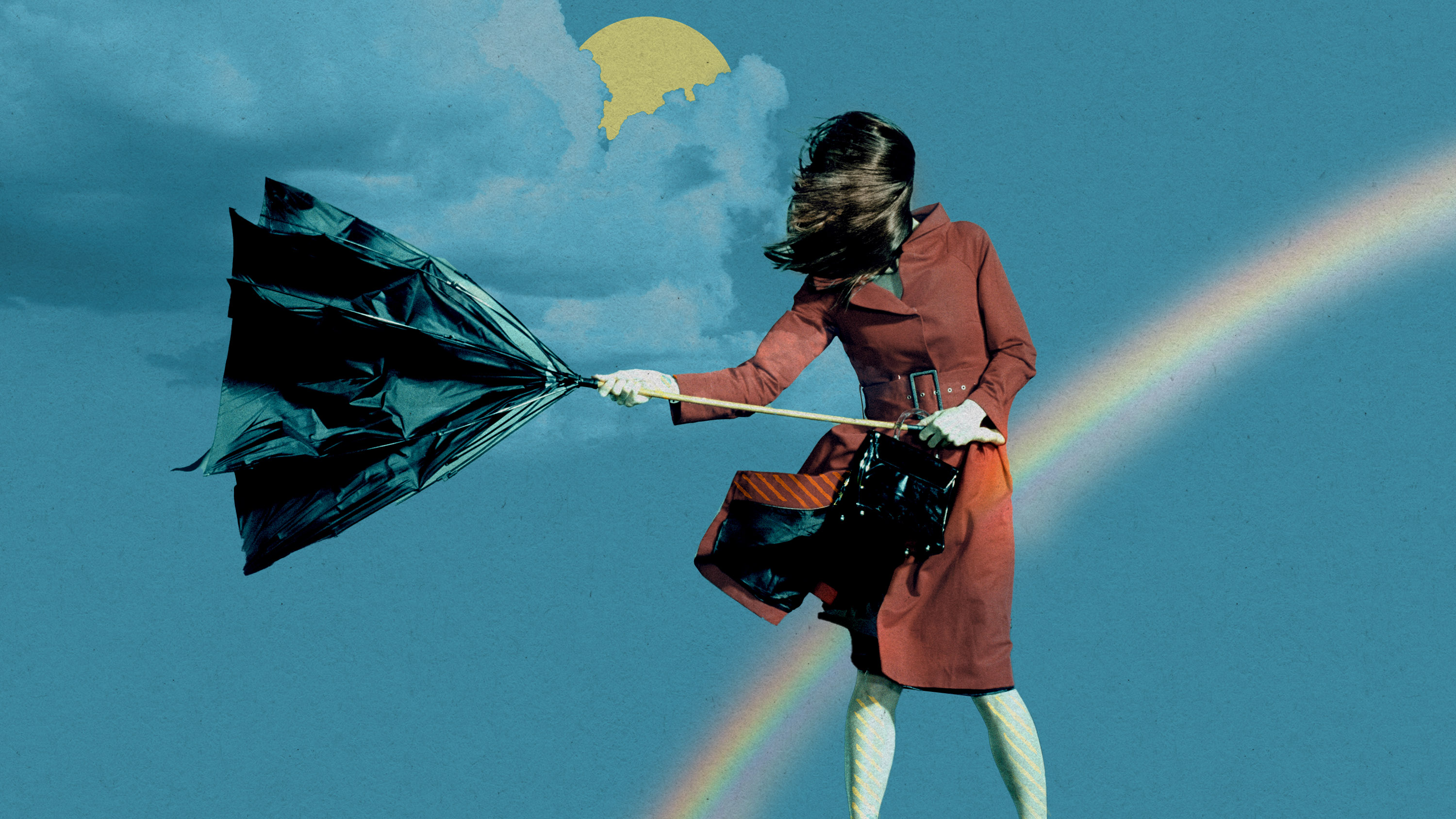 woman with hair and umbrella blown strongly to the left in front of a sun behind clouds and a rainbow