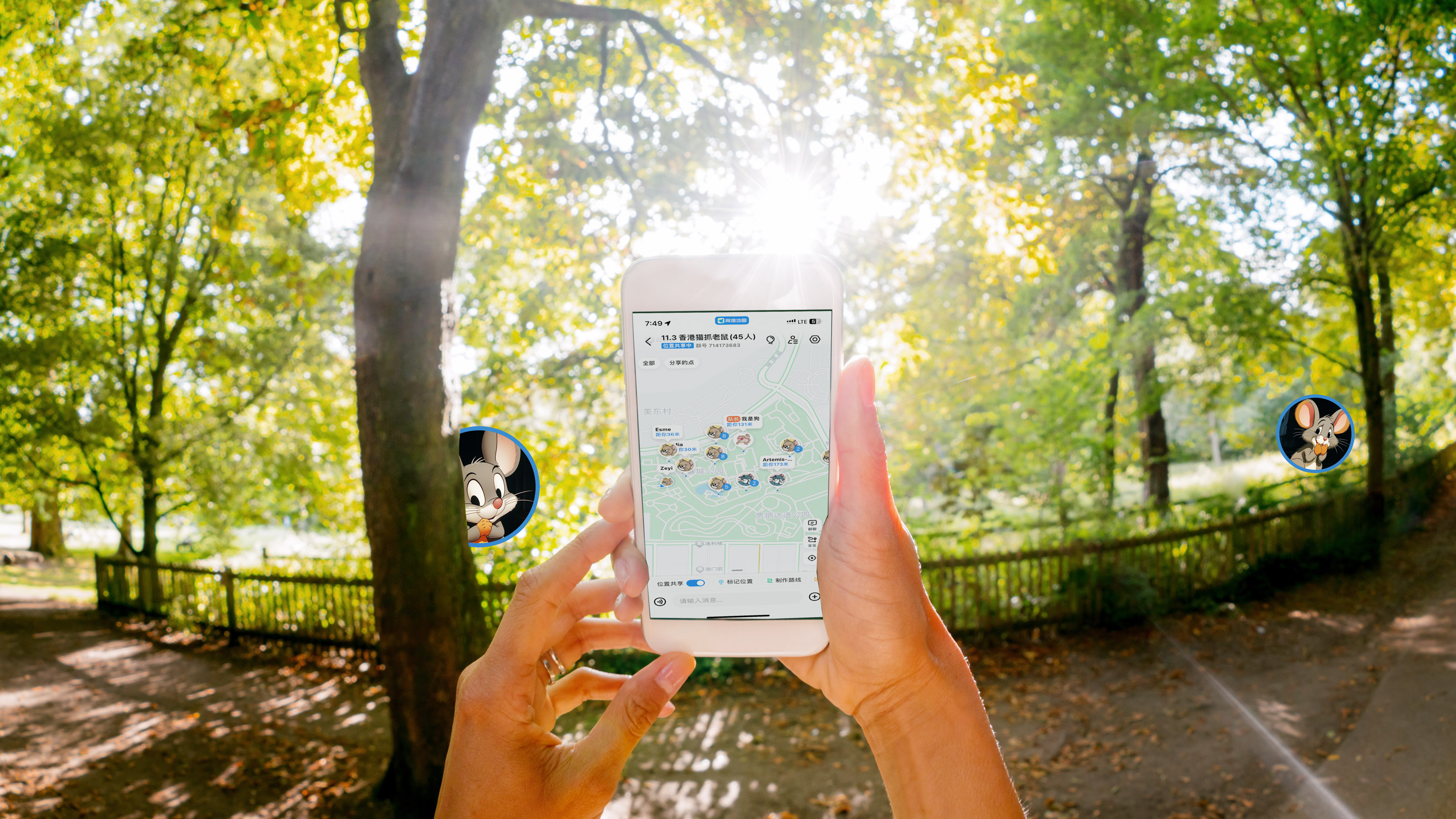 hands holding a cell phone with a map screen in a sunlit park. cartoon mouse icons are dropped into the landscape between the trees