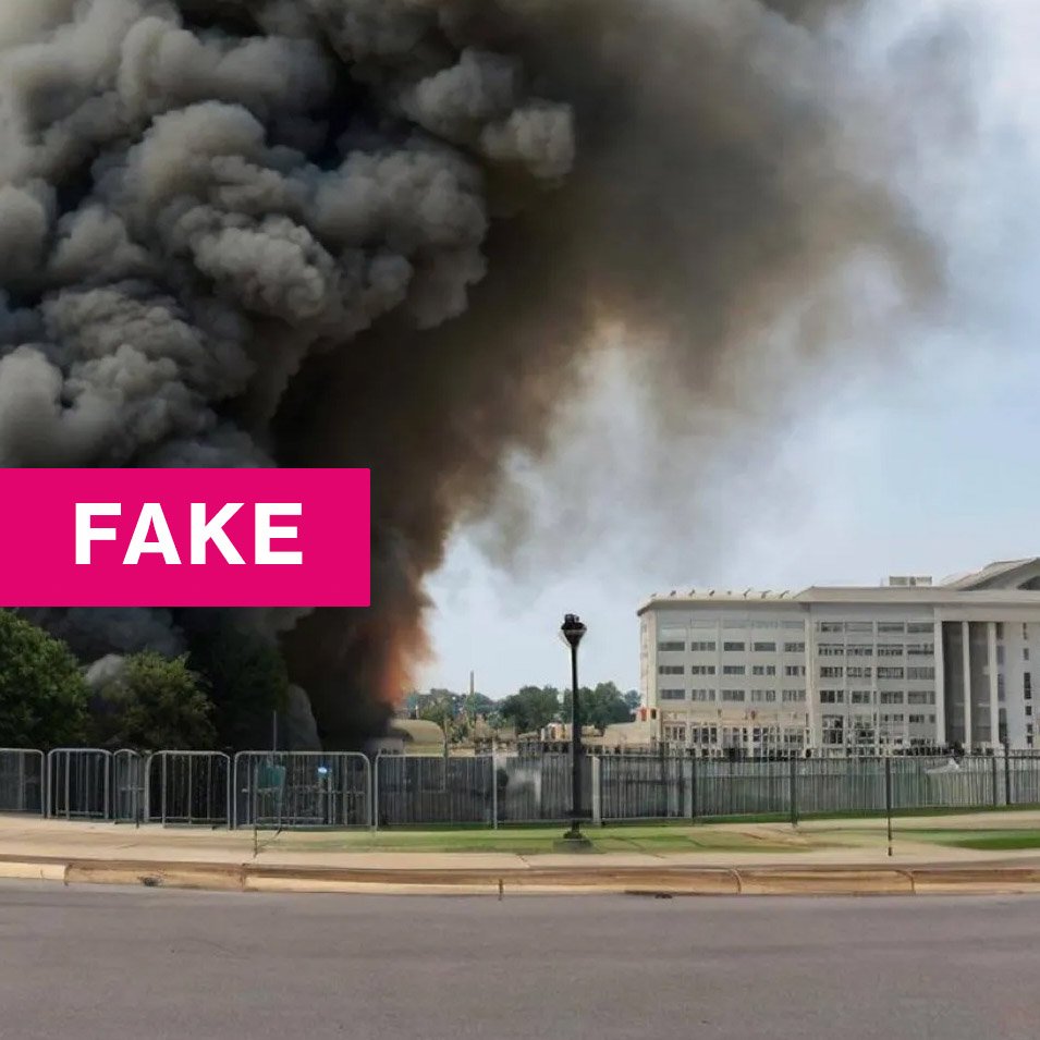 an a.i generated image of a smoke filled frame of the area of the Pentagon with the caption "FAKE" over it