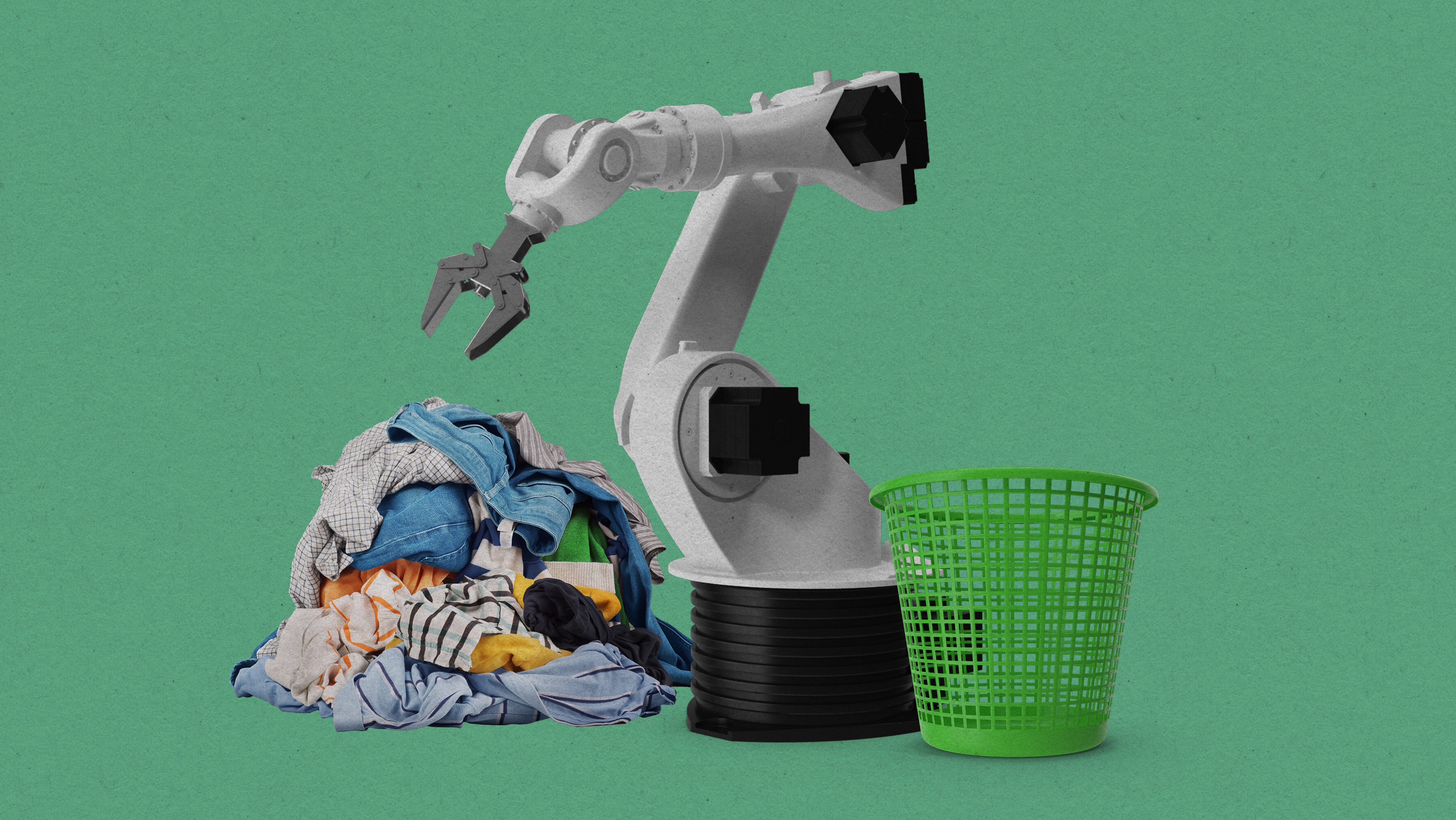 robot arm next to a laundry basket and pile of clothes