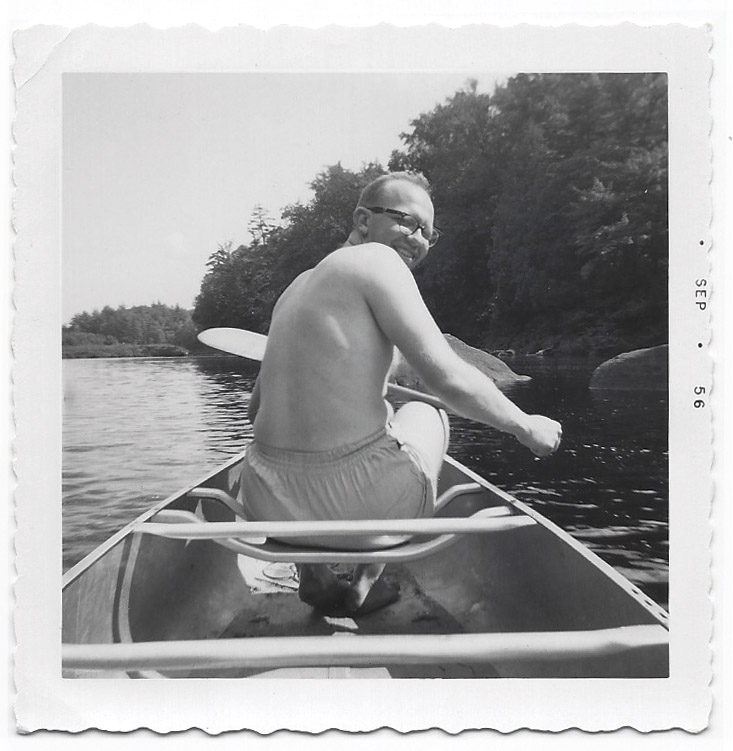 old black and white photo of William Miller in a canoe